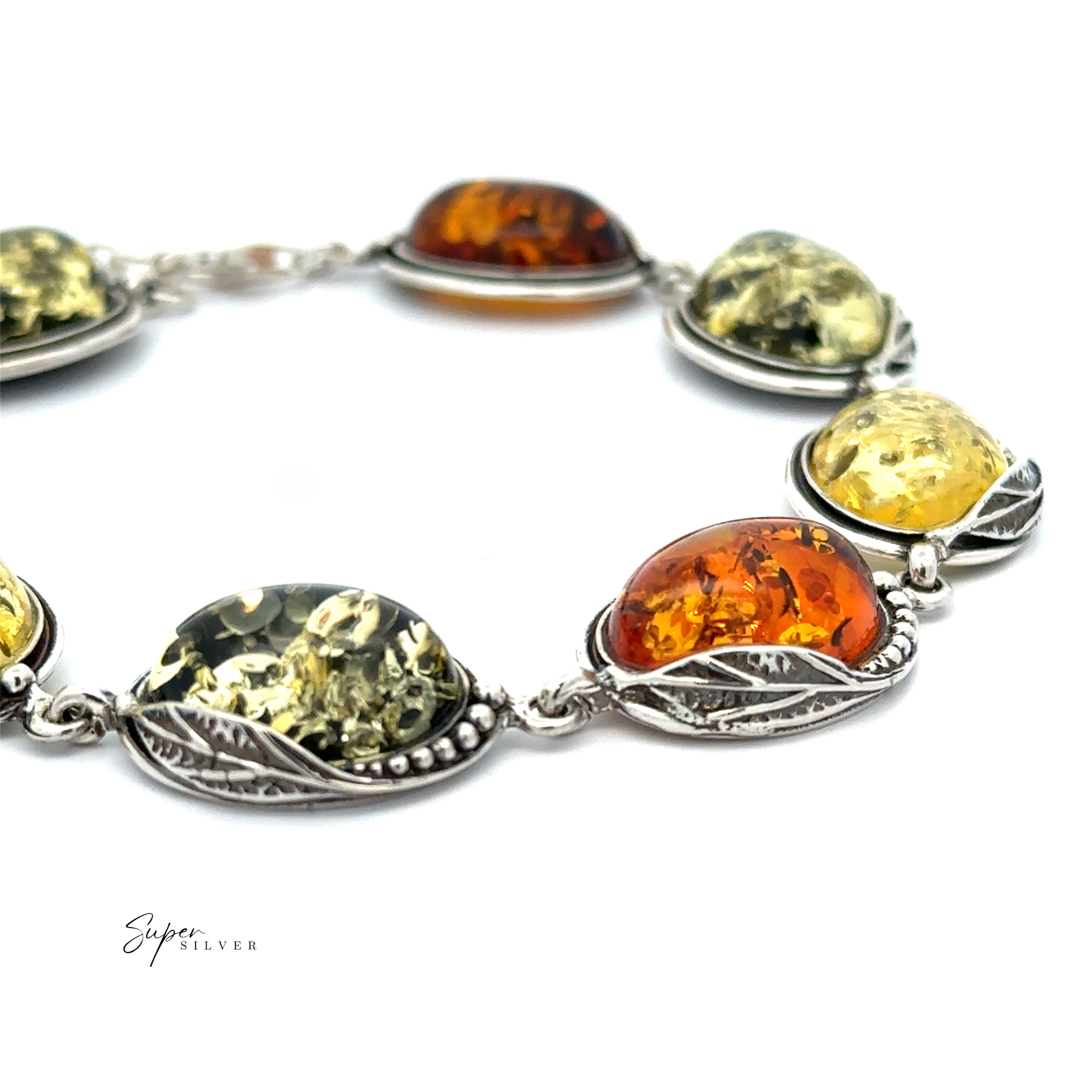The Oval Amber Link Bracelet With Leaf Detail boasts an enchanting vintage charm, showcasing alternating yellow and orange oval gemstones reminiscent of cognac amber stones, each elegantly encased in a detailed silver setting.