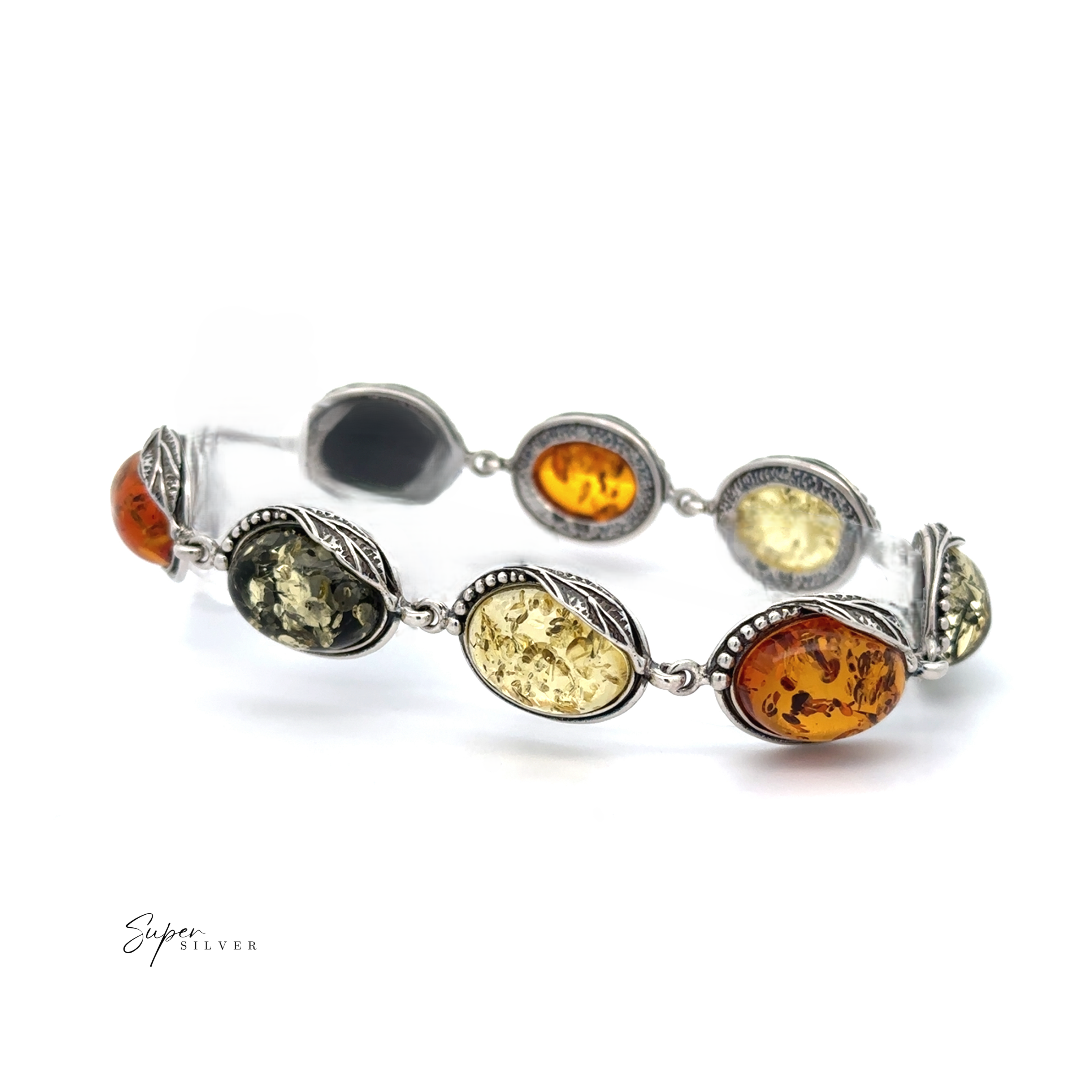 The Oval Amber Link Bracelet With Leaf Detail showcases timeless elegance and vintage charm with its silver design featuring oval Baltic amber stones in various shades, accented by intricate leaf motifs around each stone.