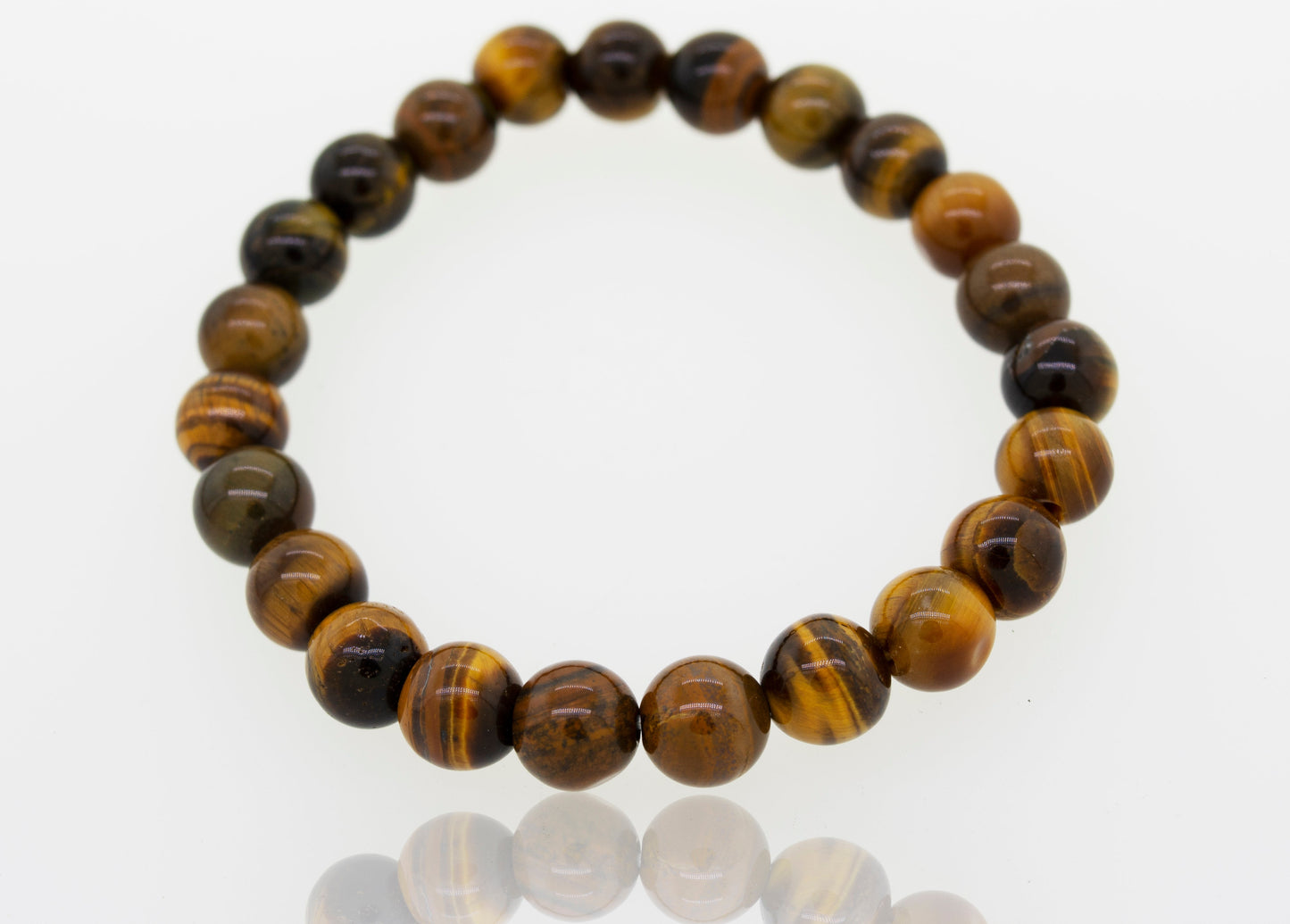 
                  
                    4mm Beaded Stone Bracelets made of polished tiger's eye stones, described as a healing stone bracelet, displayed on a reflective white surface.
                  
                