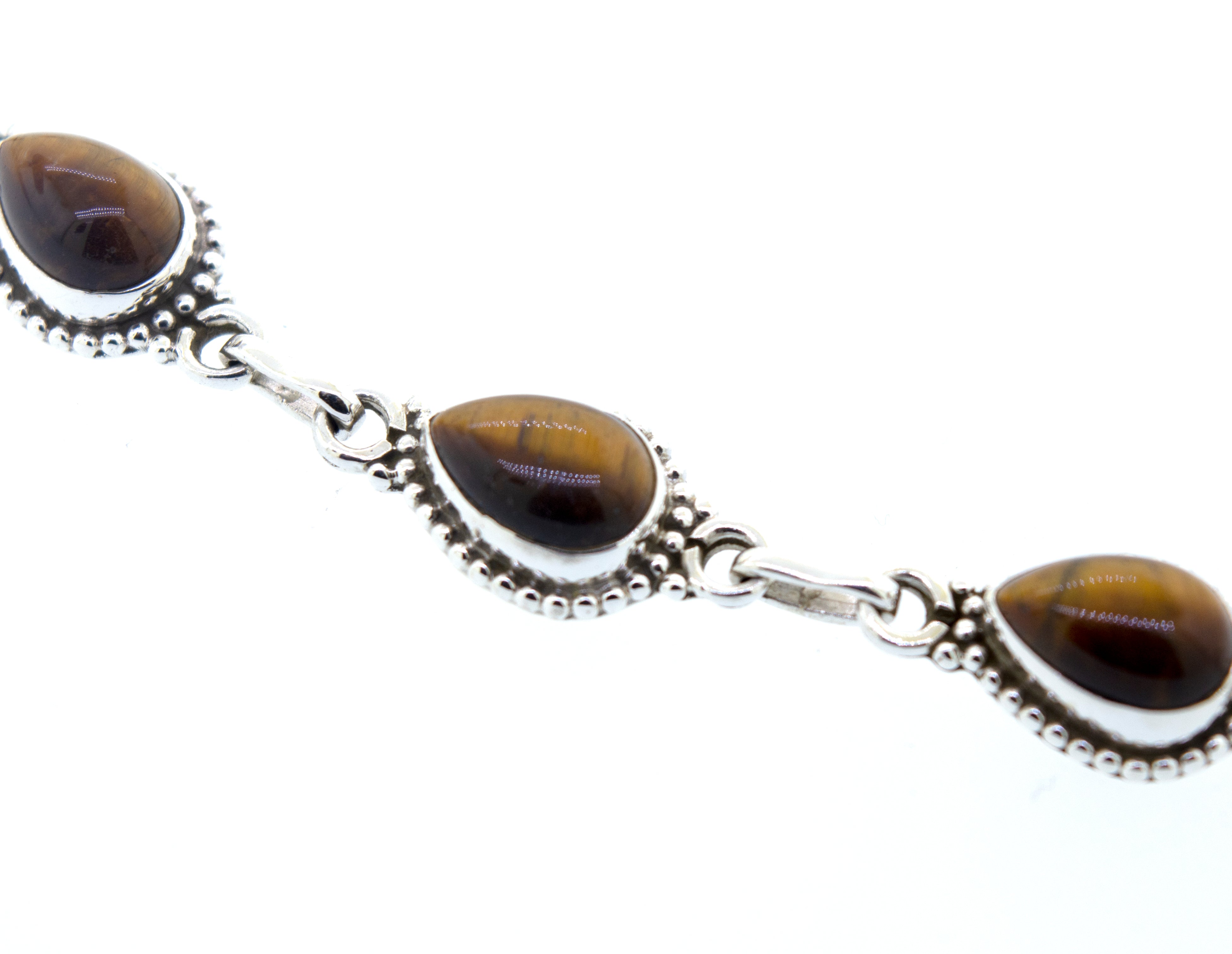 Teardrop Shape Stone Bracelet With Ball Border with three teardrop-shaped Tiger's Eye stones linked by small silver chains, crafted from .925 silver, isolated on a white background.