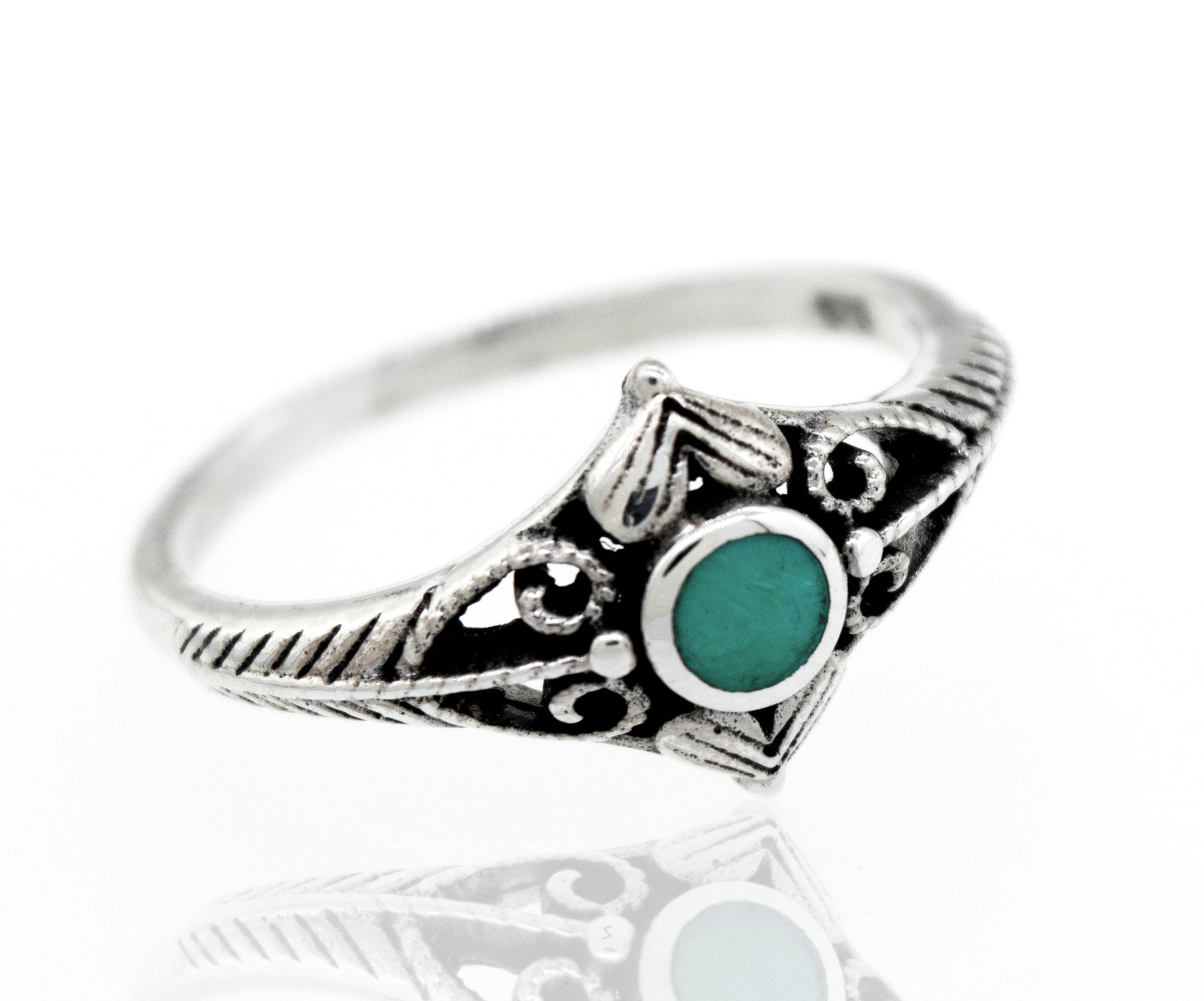 An Inlaid Stone Diamond Shaped Ring with Filigree Accents with a turquoise stone.