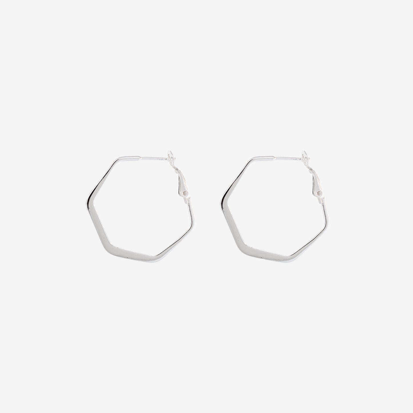 A pair of Flat Hexagon Hinged Hoops by Super Silver on a white background.