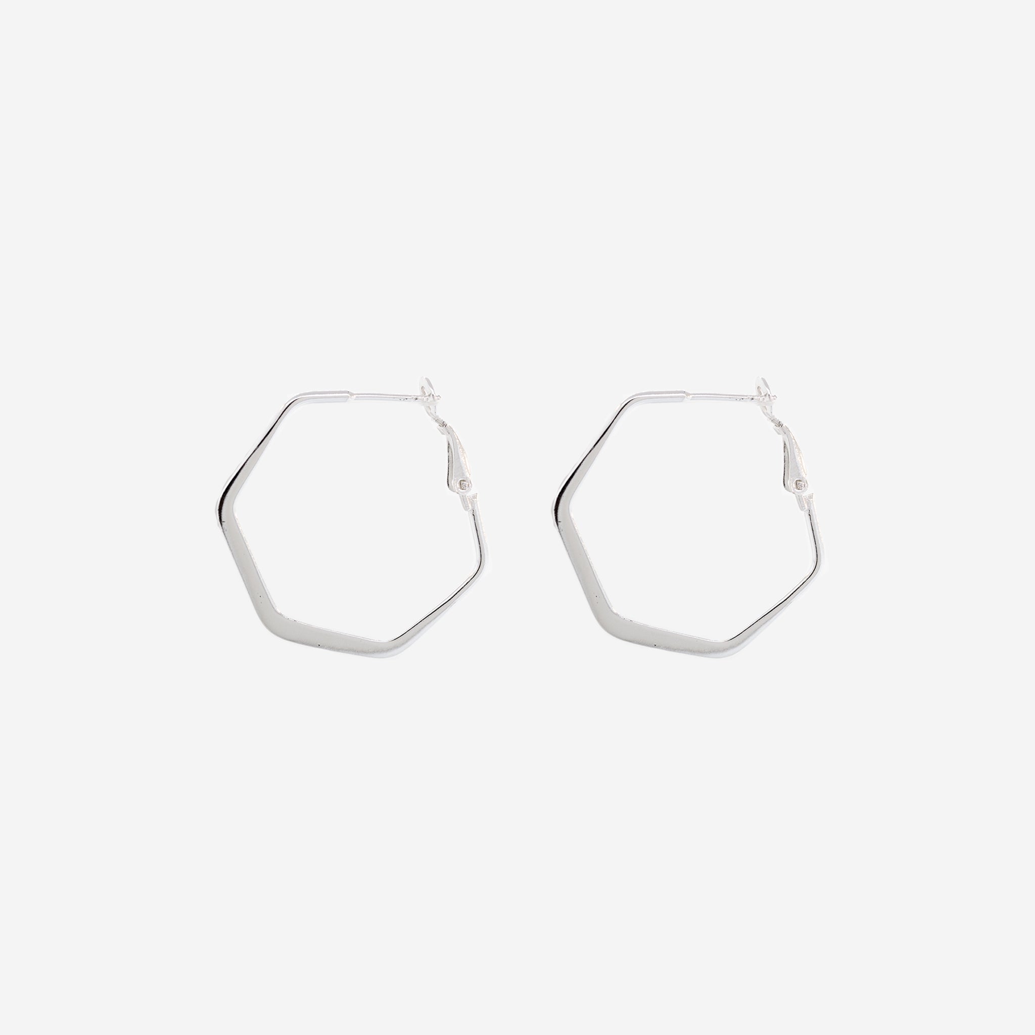 A pair of Flat Hexagon Hinged Hoops by Super Silver on a white background.