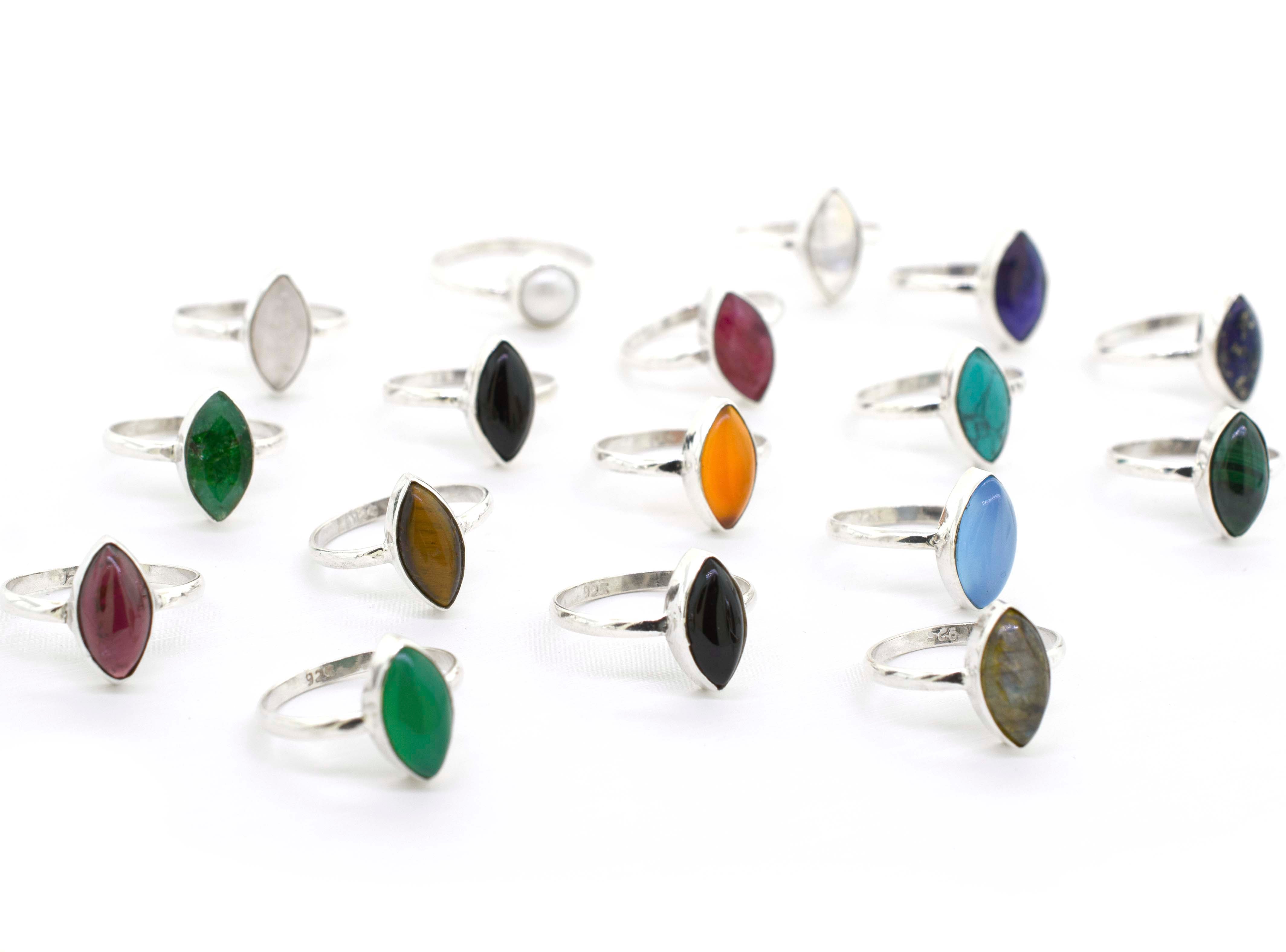 A group of Simple Marquise Shaped Gemstone Rings on a white background.