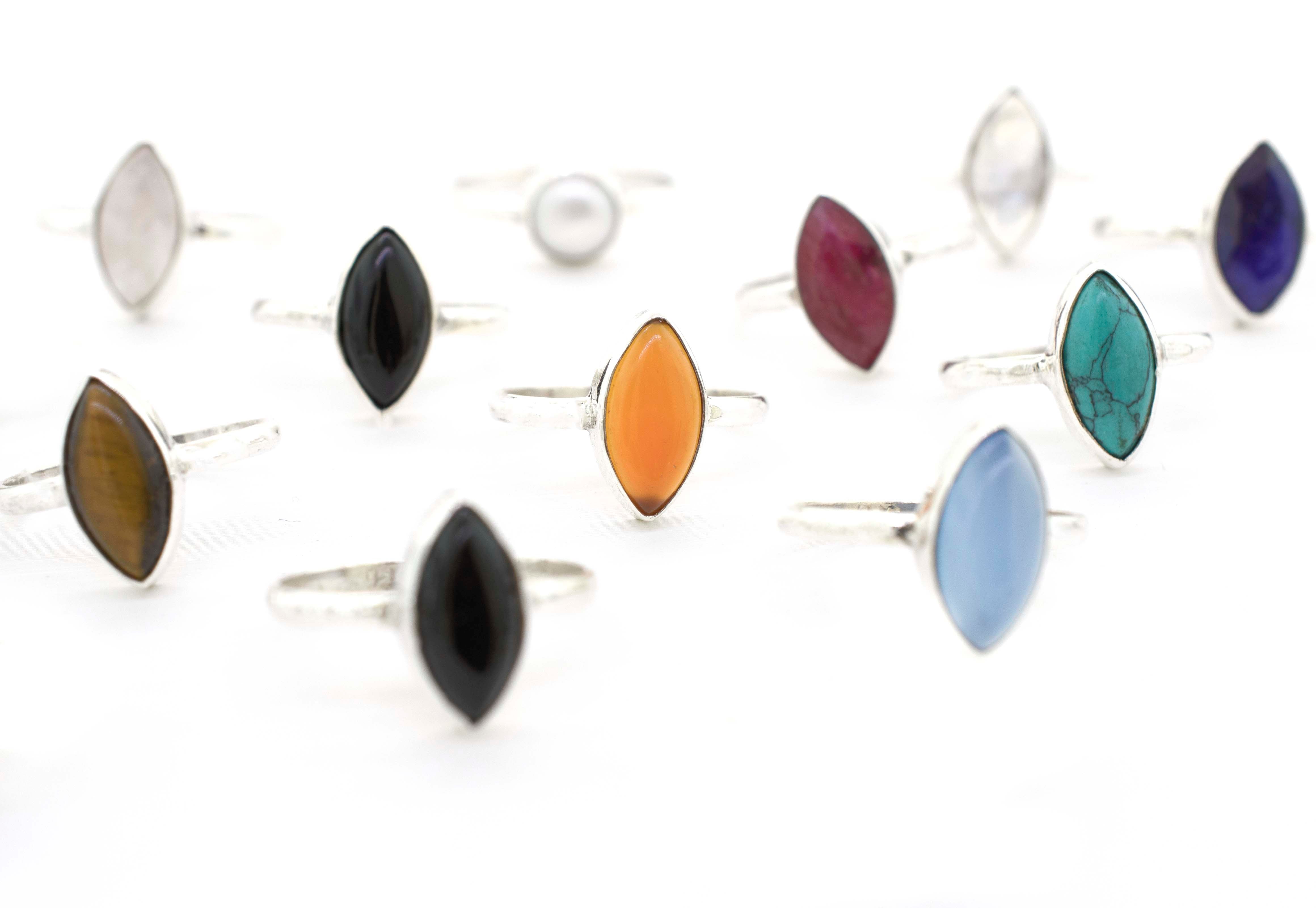 A group of Simple Marquise Shaped Gemstone Rings with different colored stones, perfect for hippies in Santa Cruz seeking a natural and bohemian look.
