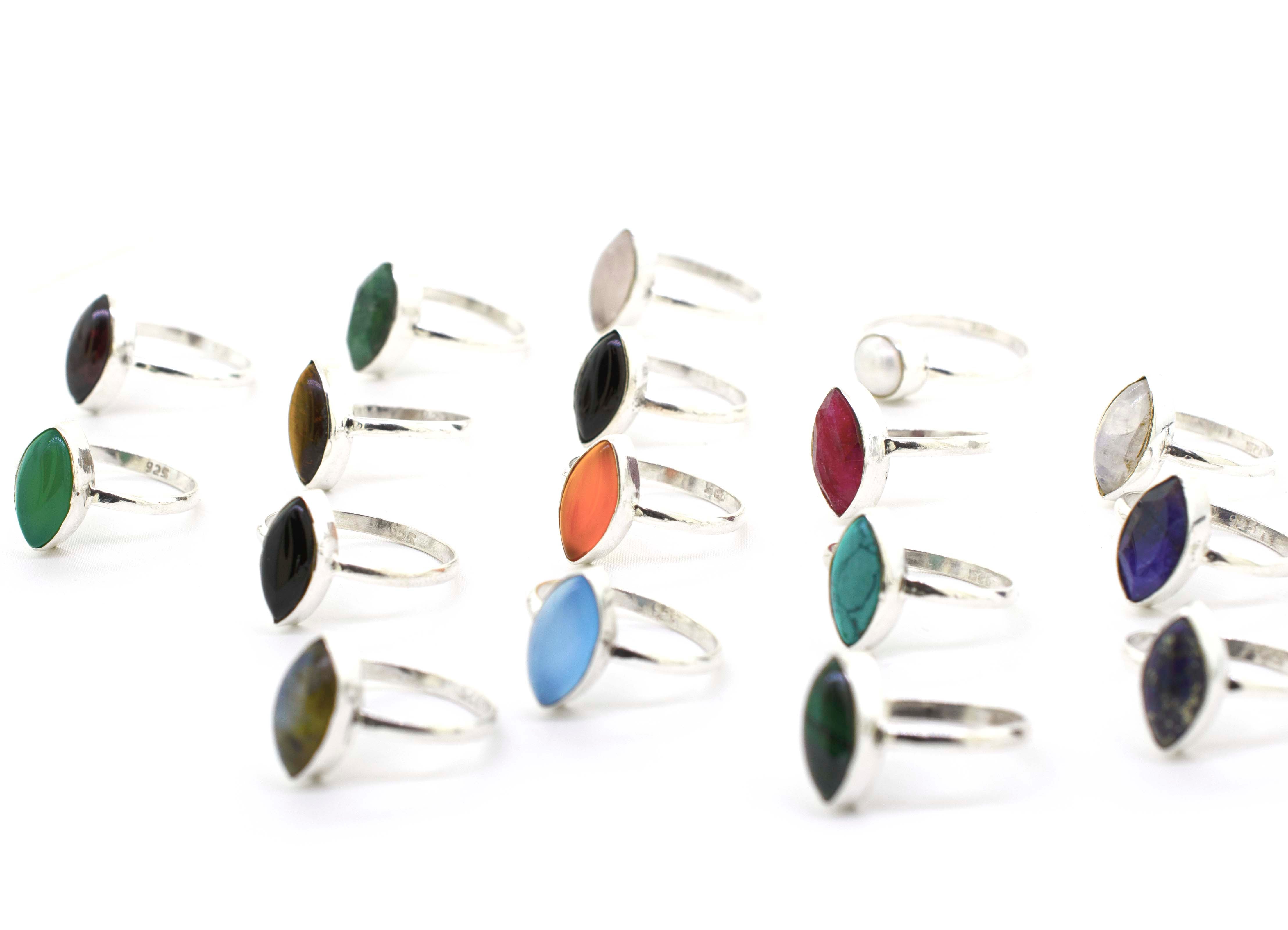 A boho-inspired collection of Simple Marquise Shaped Gemstone Rings adorned with cabochon stones in various vibrant colors.