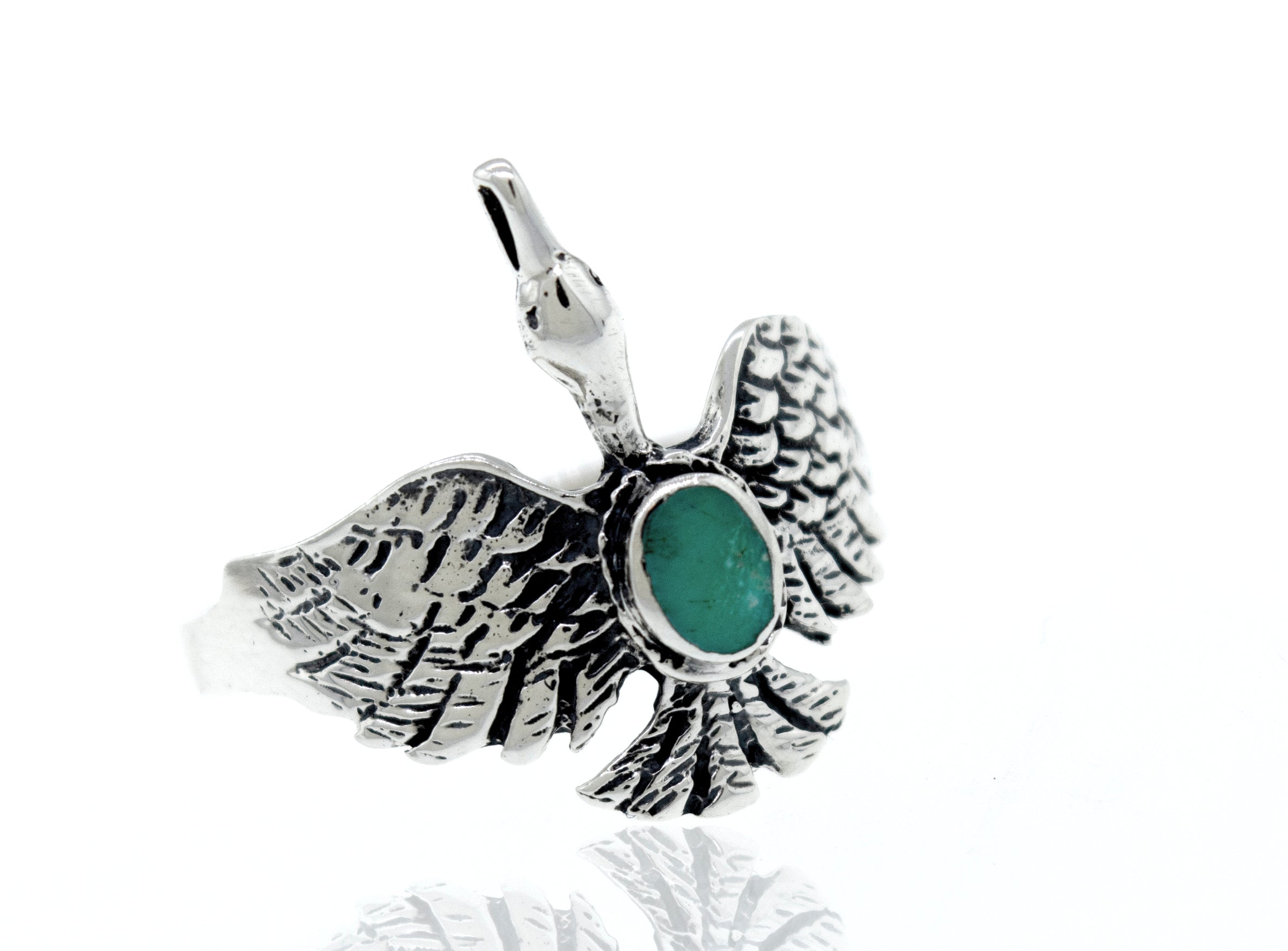 A silver Swan Ring with an oval emerald stone inspired by nature.