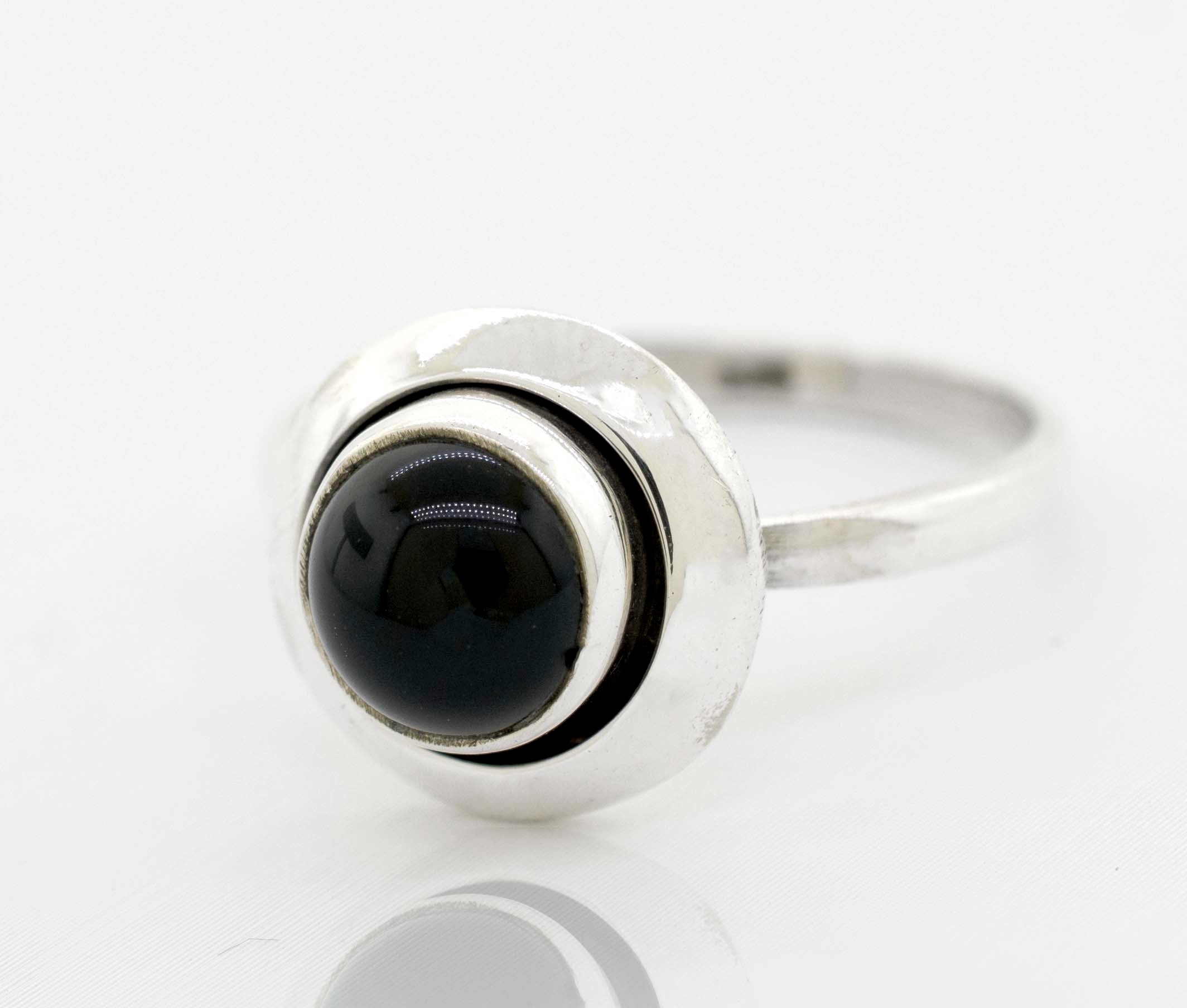 A Super Silver contemporary sophistication ring with a round gemstone ring with oxidized outline.