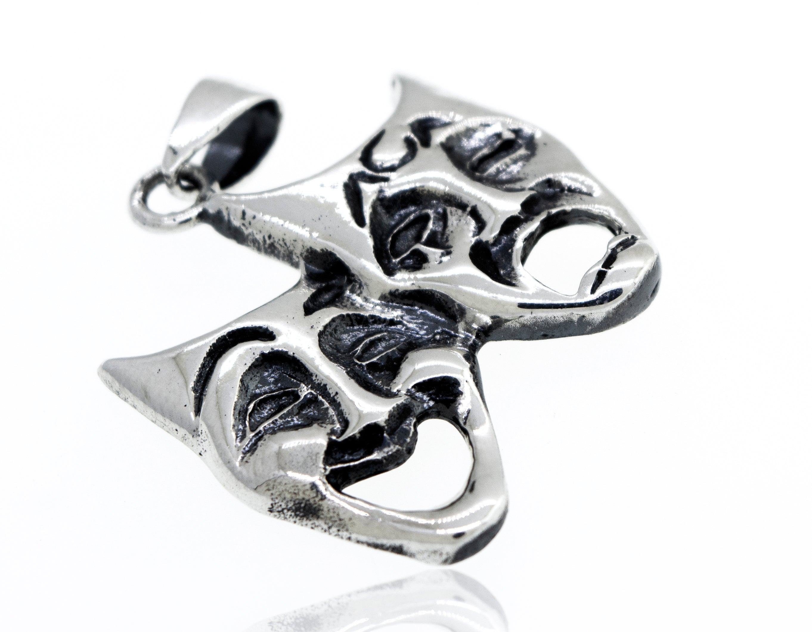 A Super Silver Laugh Now Cry Later pendant with two theatre masks engraved on it.