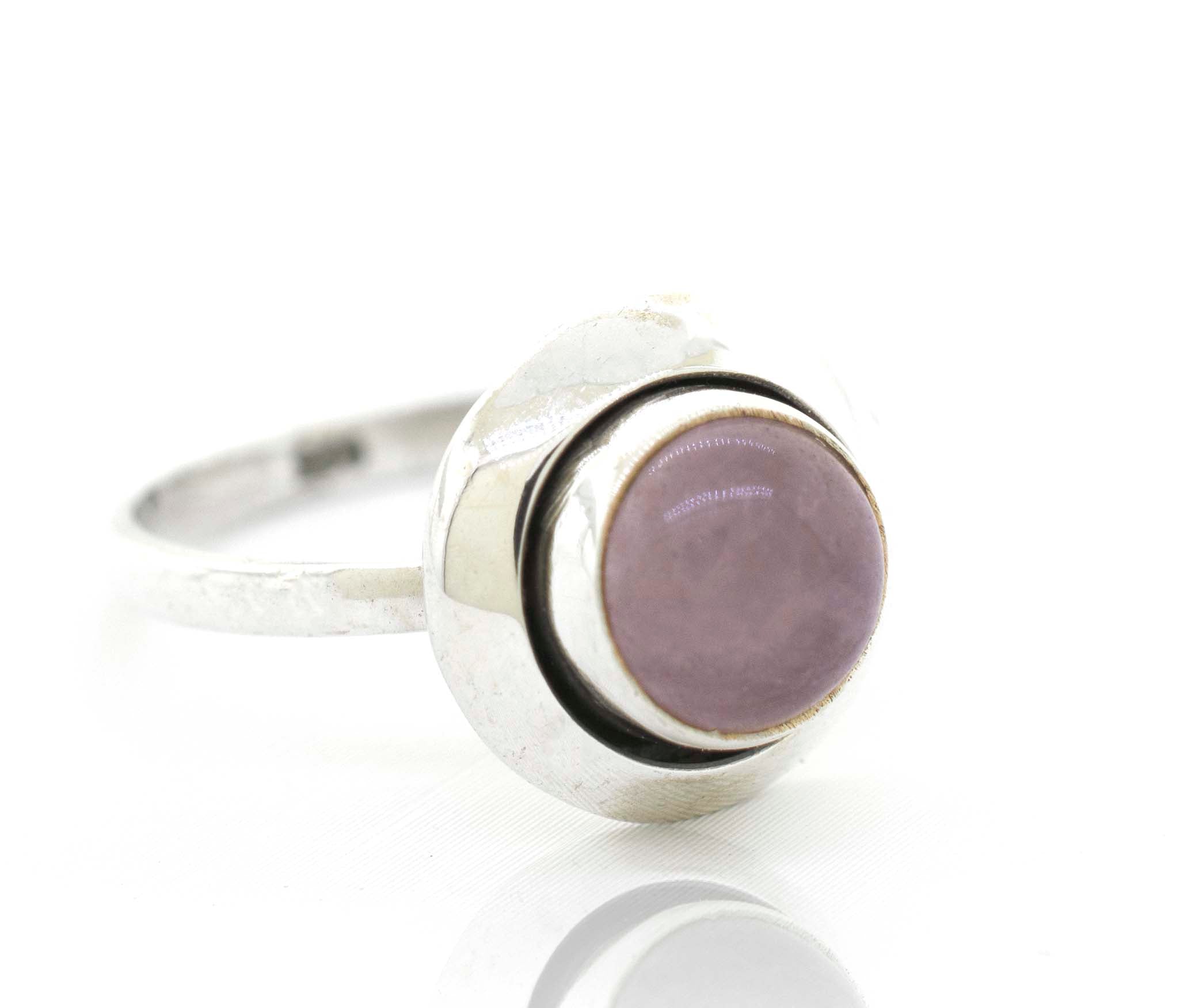 A Super Silver Round Gemstone Ring With Oxidized Outline.