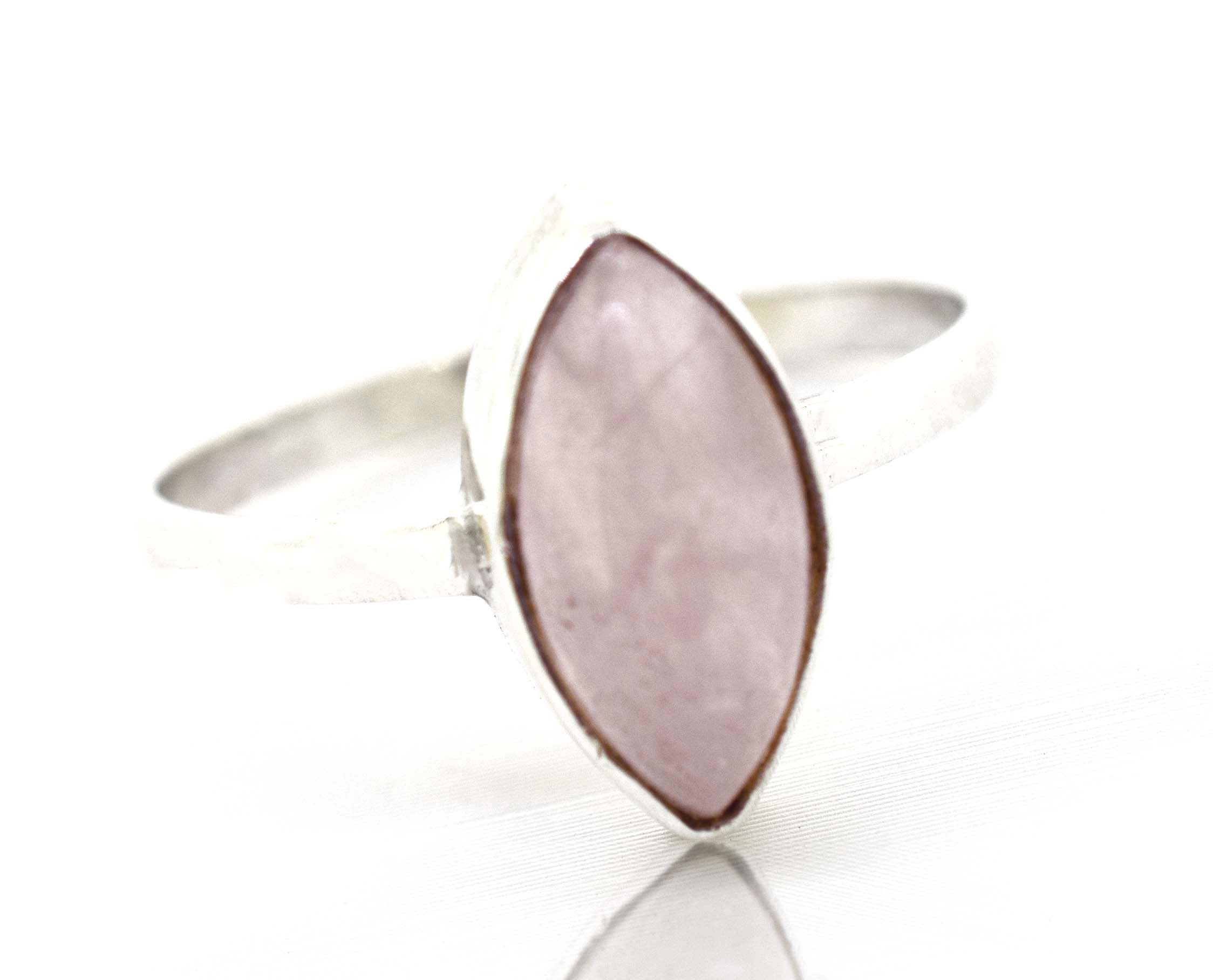 A Super Silver Simple Marquise Shaped Gemstone Ring with a pink gemstone.
