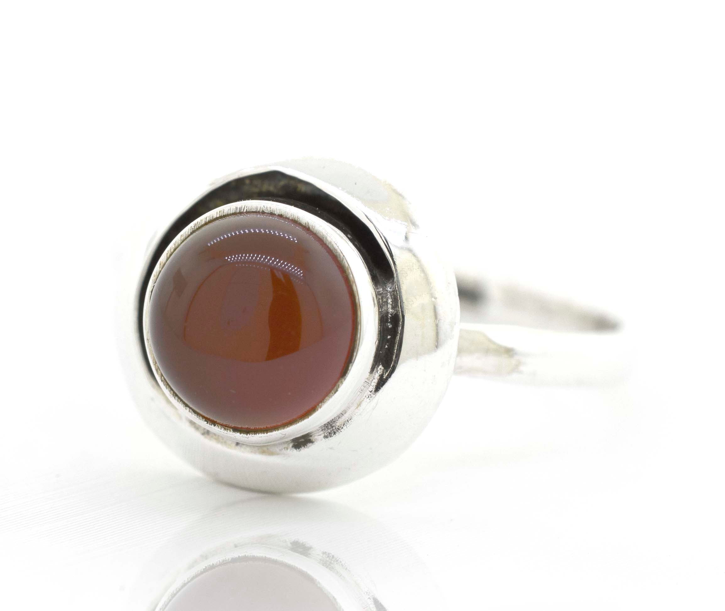 A Round Gemstone Ring With Oxidized Outline from Super Silver, with a brown stone.