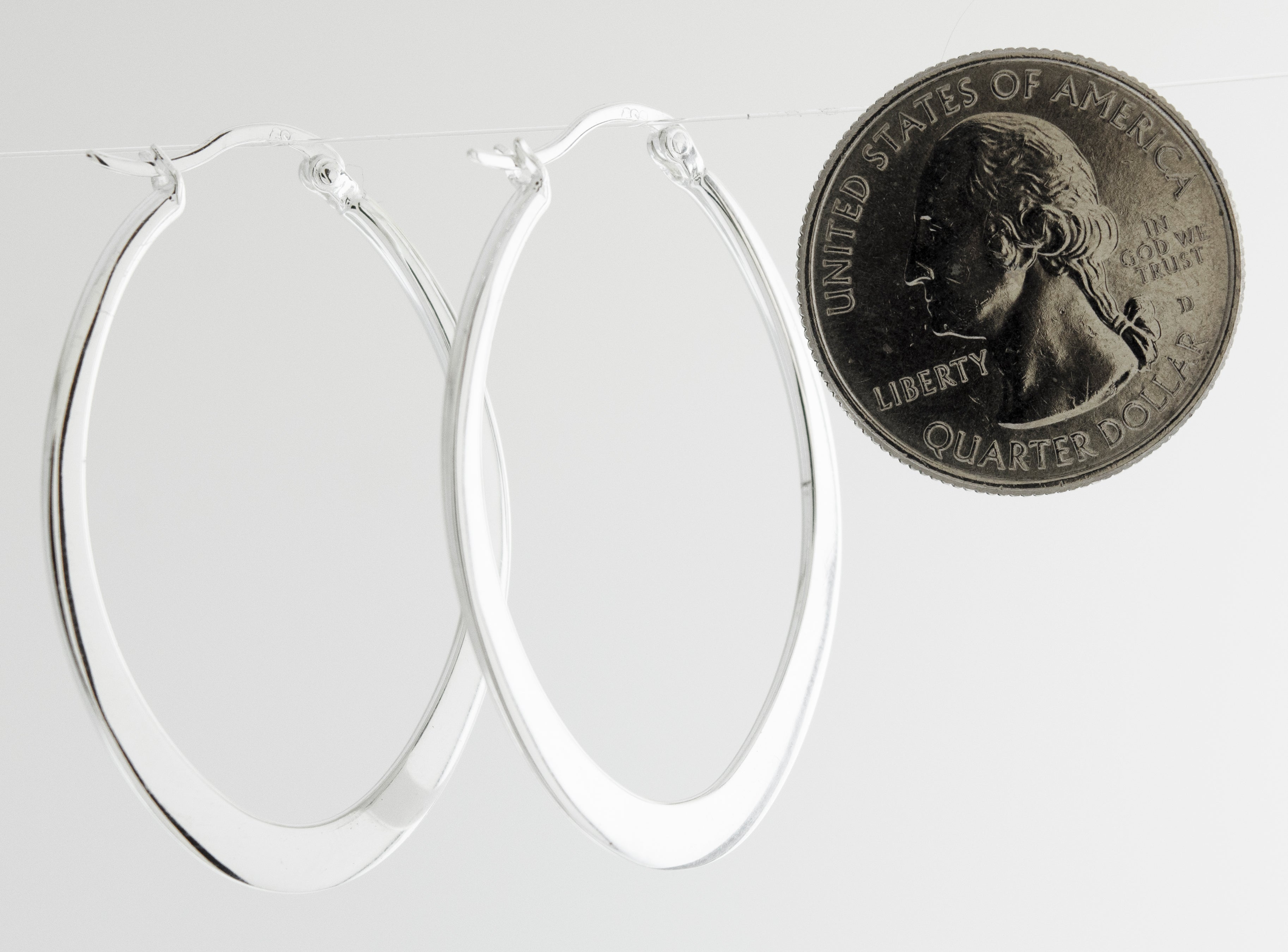 A minimalist pair of Super Silver Oval Shaped Hoops.
