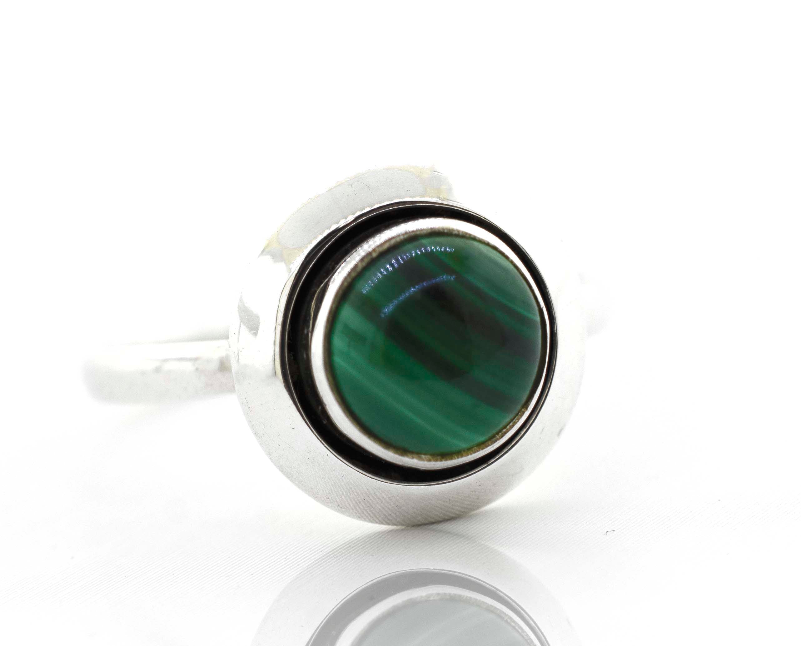 A Round Gemstone Ring With Oxidized Outline by Super Silver, featuring a minimalist design.