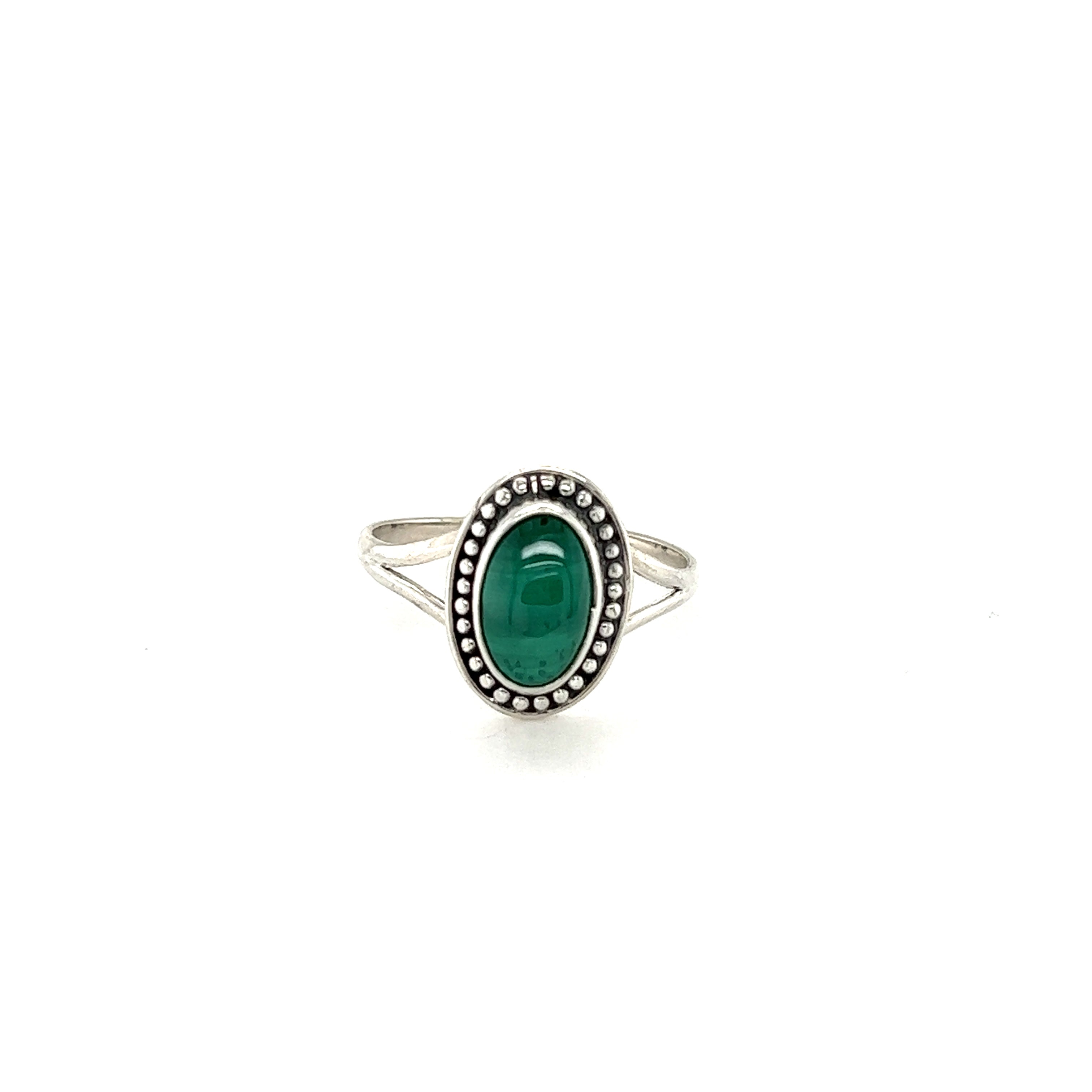 A shield-shaped emerald stone Trendy Oval Ring by Super Silver on a white background featuring .925 Sterling Silver.