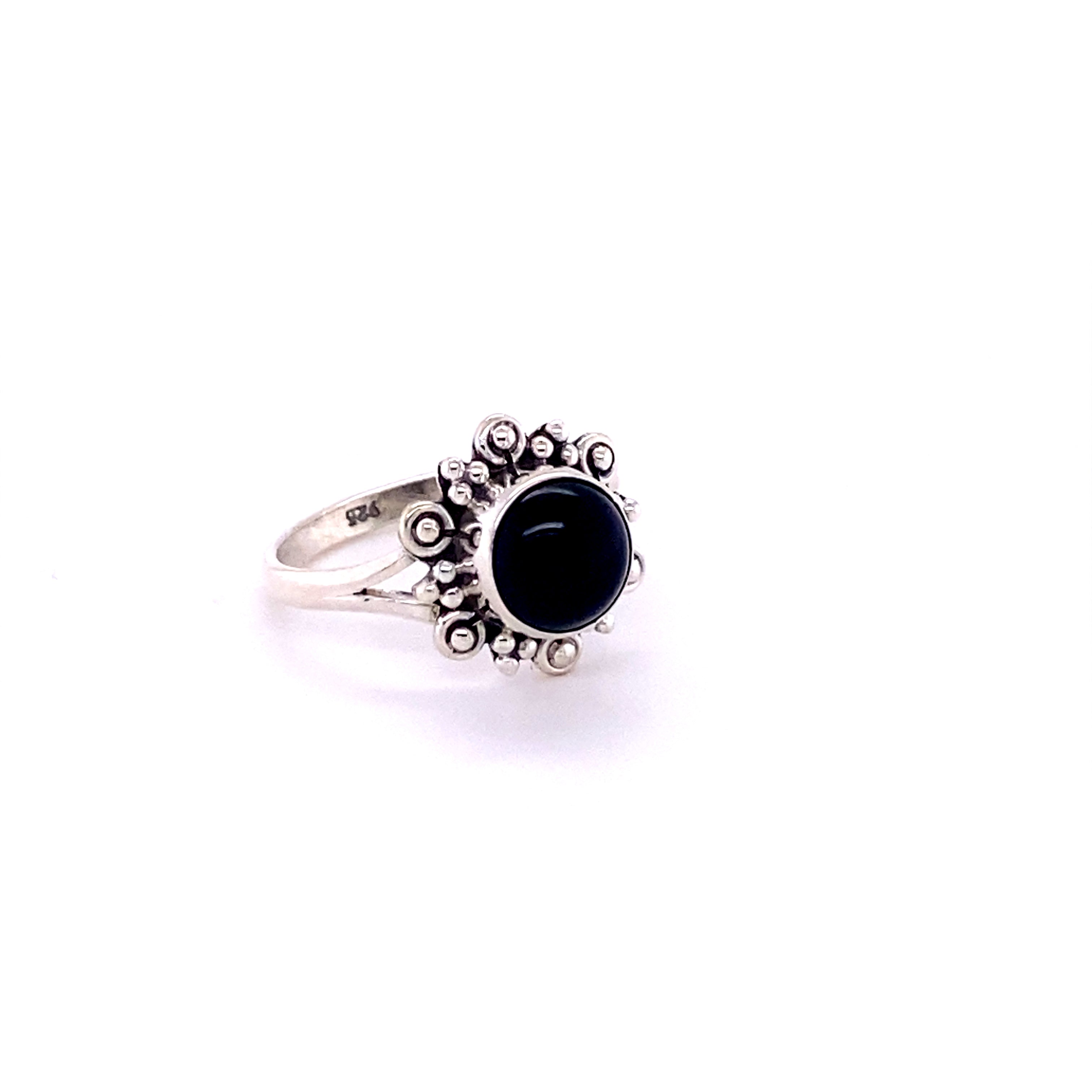 A Beautiful Round Flower Ring with Natural Gemstones with a stone.