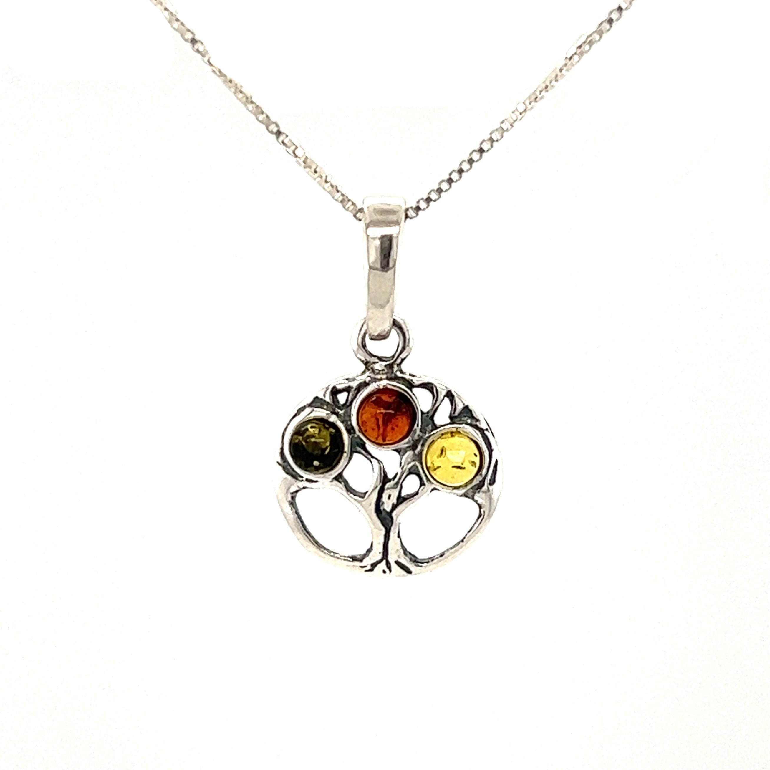 A beautiful Super Silver Dainty Amber Tree of Life Pendant necklace with Baltic amber stones.