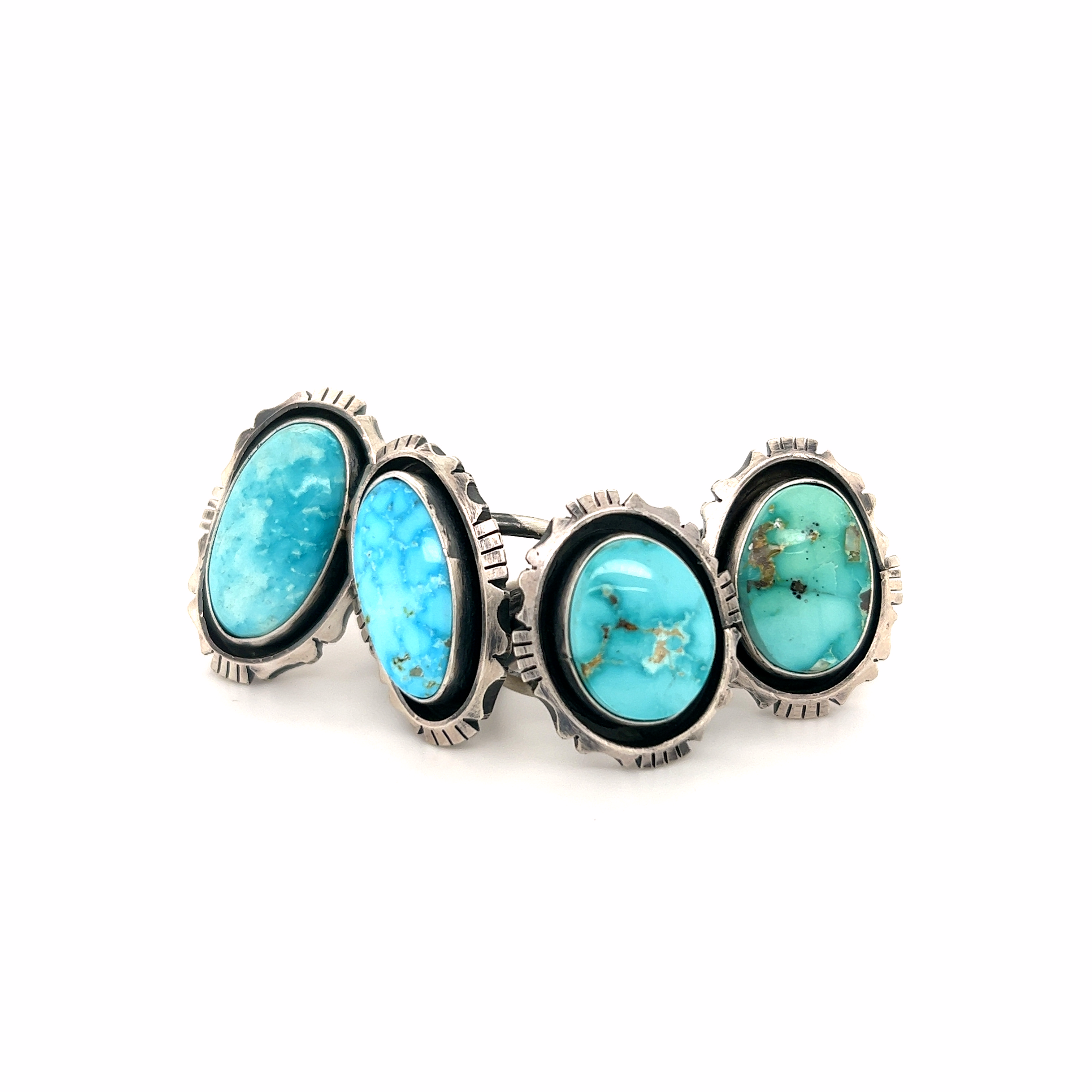A stunning Native American turquoise ring with turquoise stones.