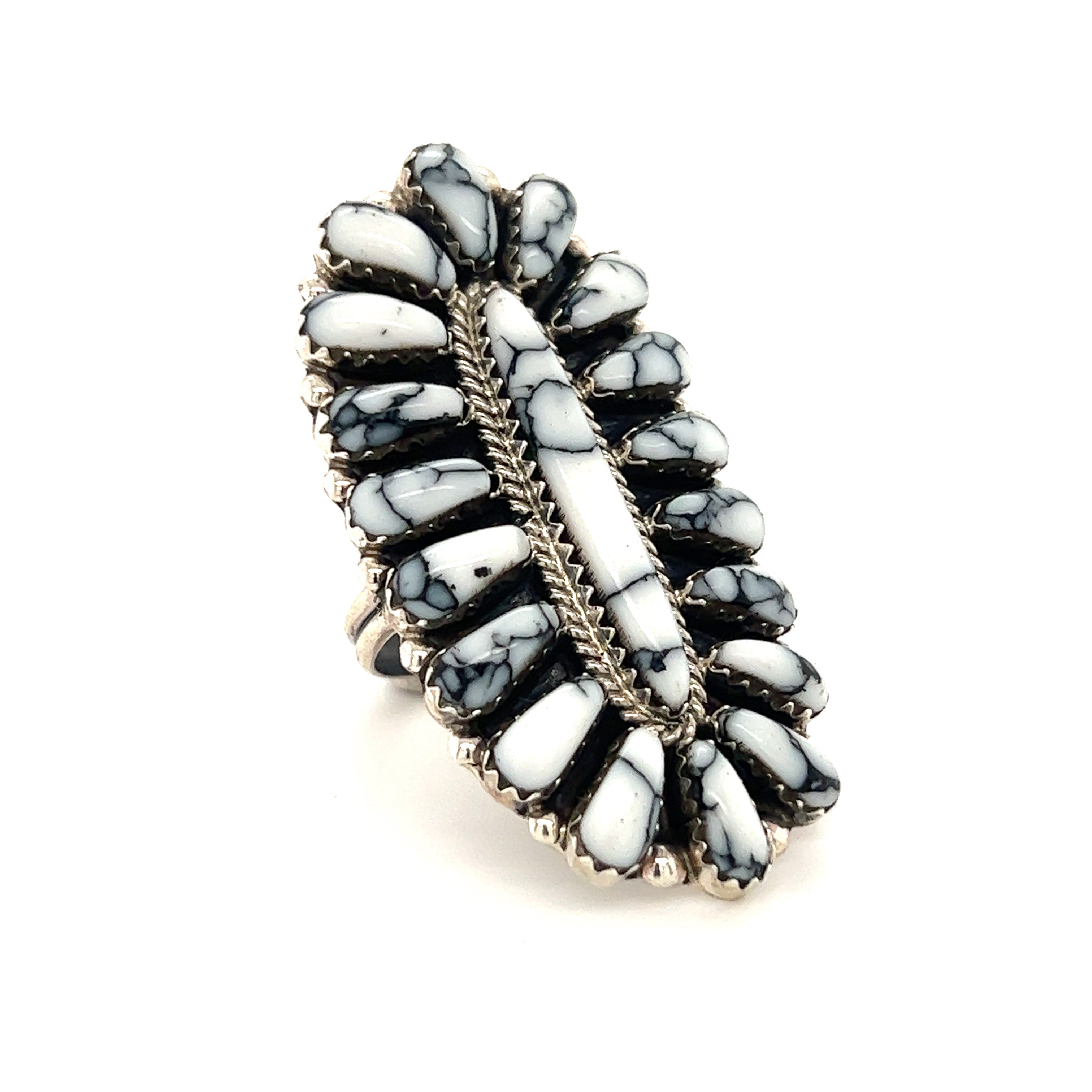 A Gorgeous Fantail Native American Ring with a black and white stone, showcased on a white background.