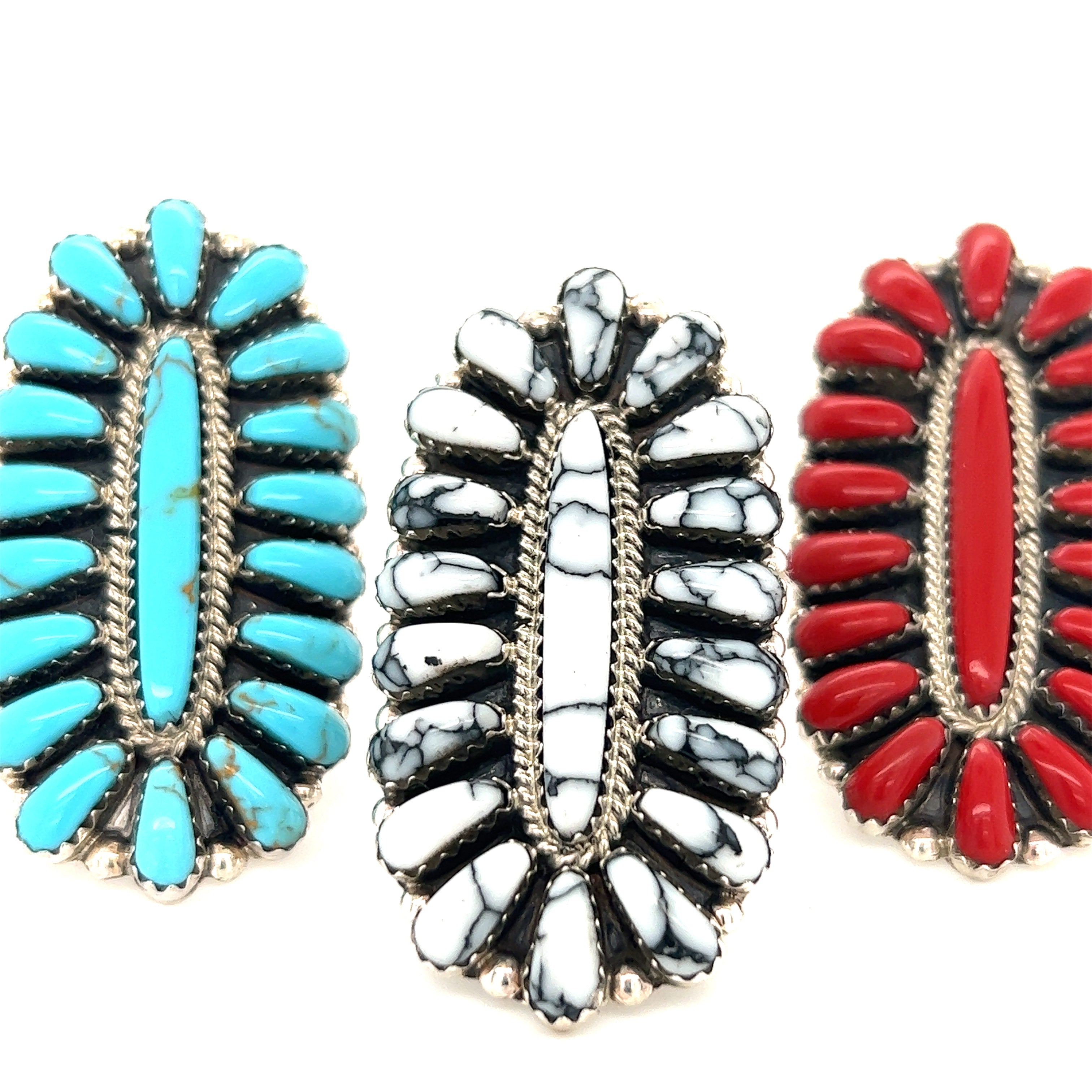 Three Gorgeous Fantail Native American rings with red, blue and white stones.