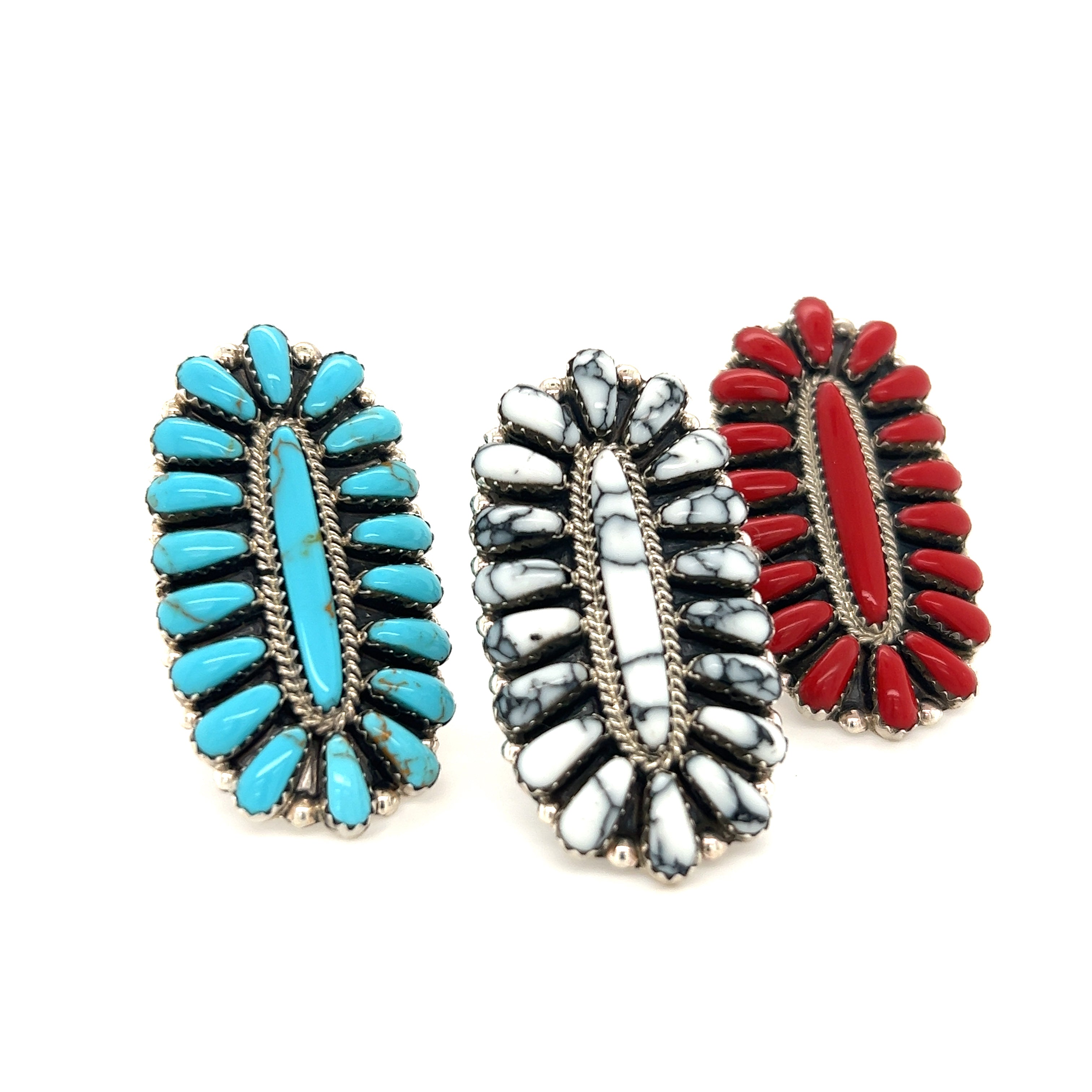 Three Gorgeous Fantail Native American Rings with red, blue and white stones.