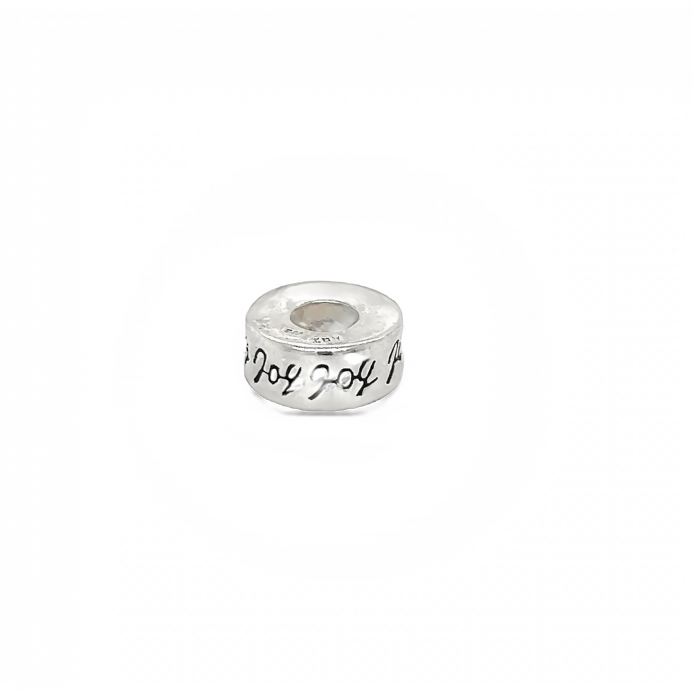 
                  
                    An Affirmation Bead Charm crafted from sterling silver with the word love elegantly inscribed, made by Super Silver.
                  
                