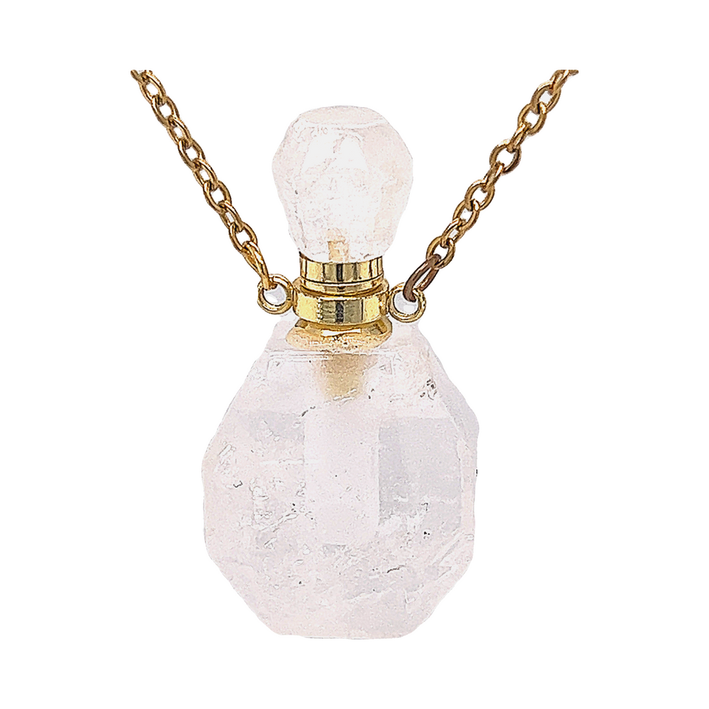 
                  
                    A Crystal Perfume Vial Necklace on a gold chain, featuring a white quartz stone by Super Silver.
                  
                