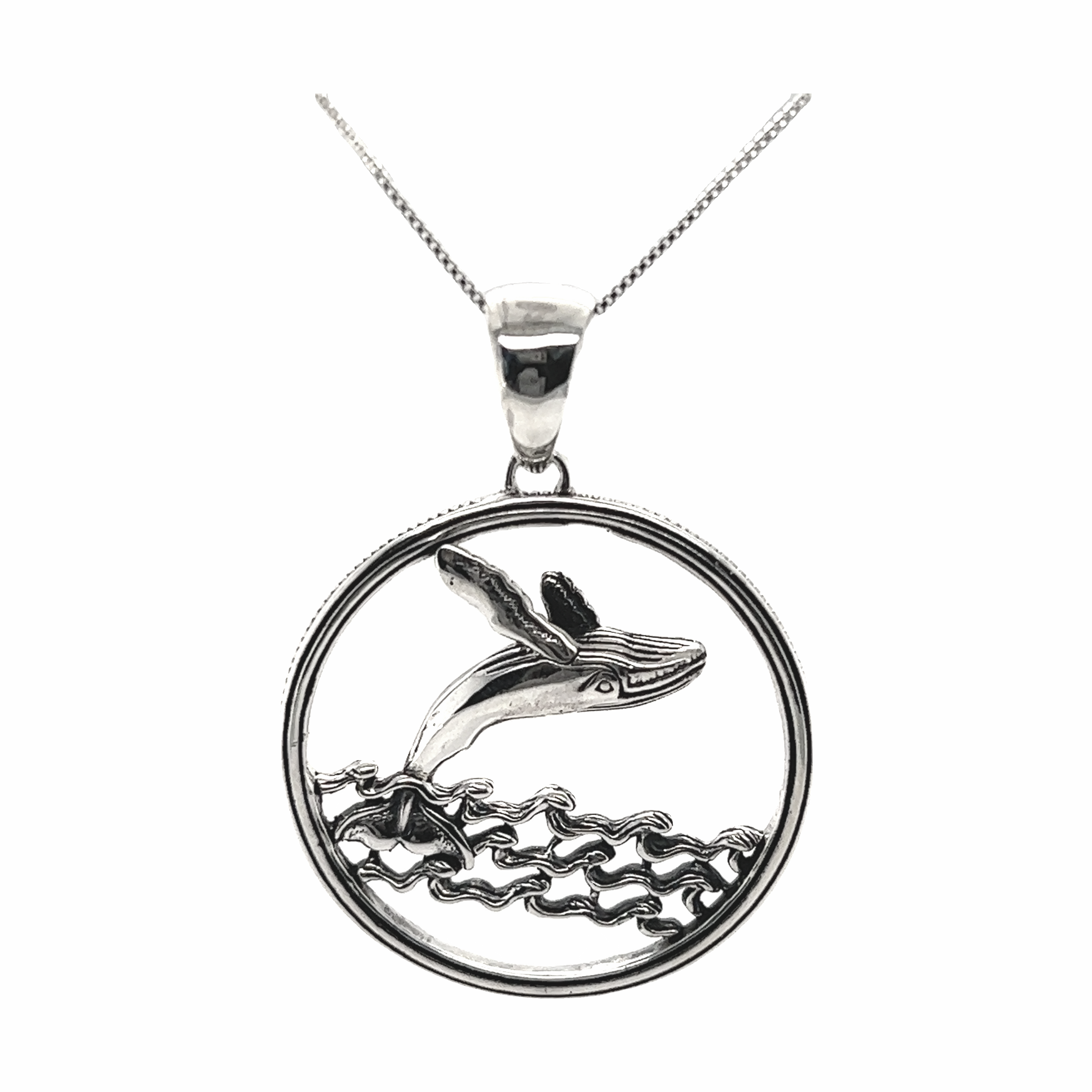 A Brilliant Whale Pendant by Super Silver, jumping out of the ocean waters near Santa Cruz.
