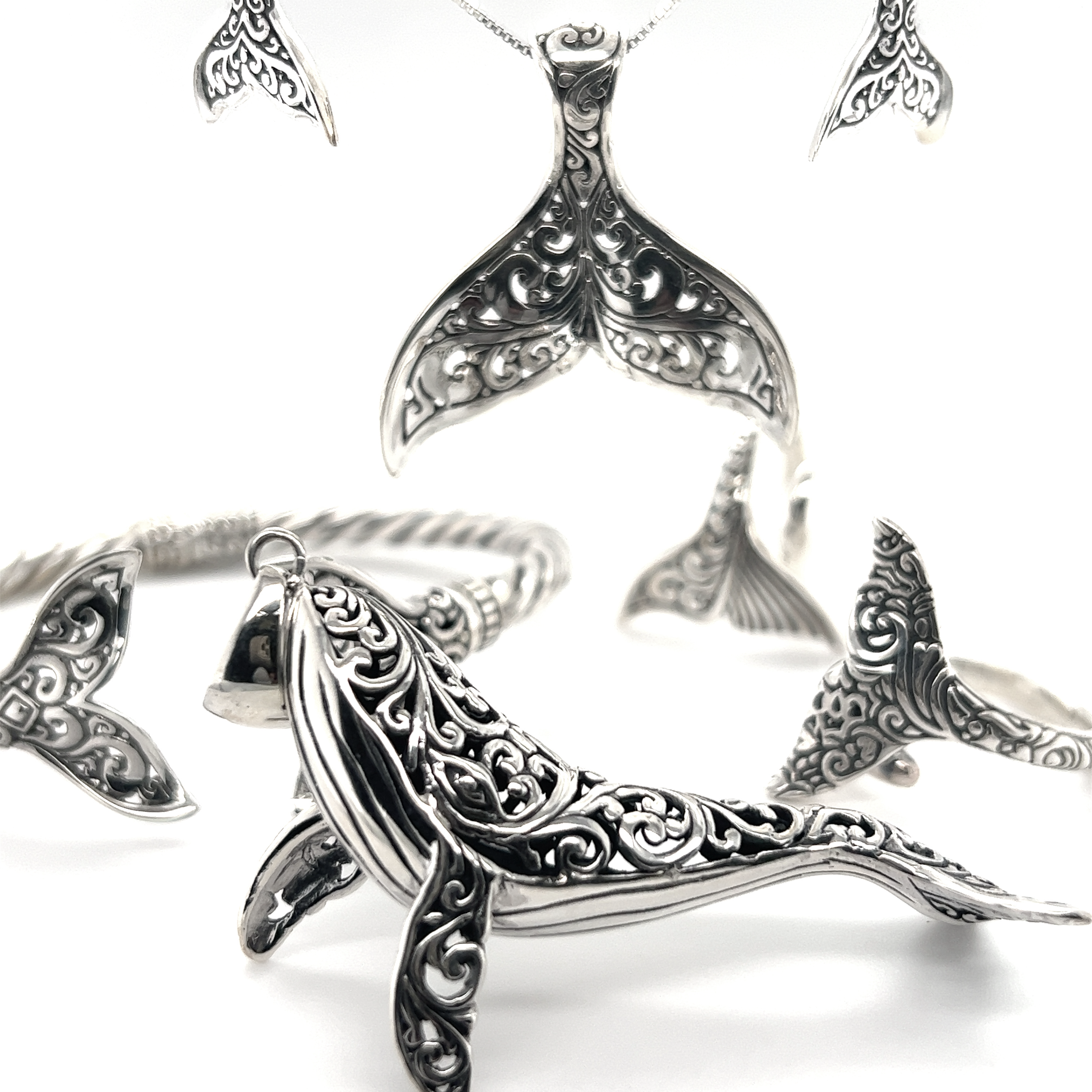 A set of Super Silver sterling silver jewelry featuring the Magnificent Filigree Whale Pendant, inspired by the ocean and Santa Cruz.