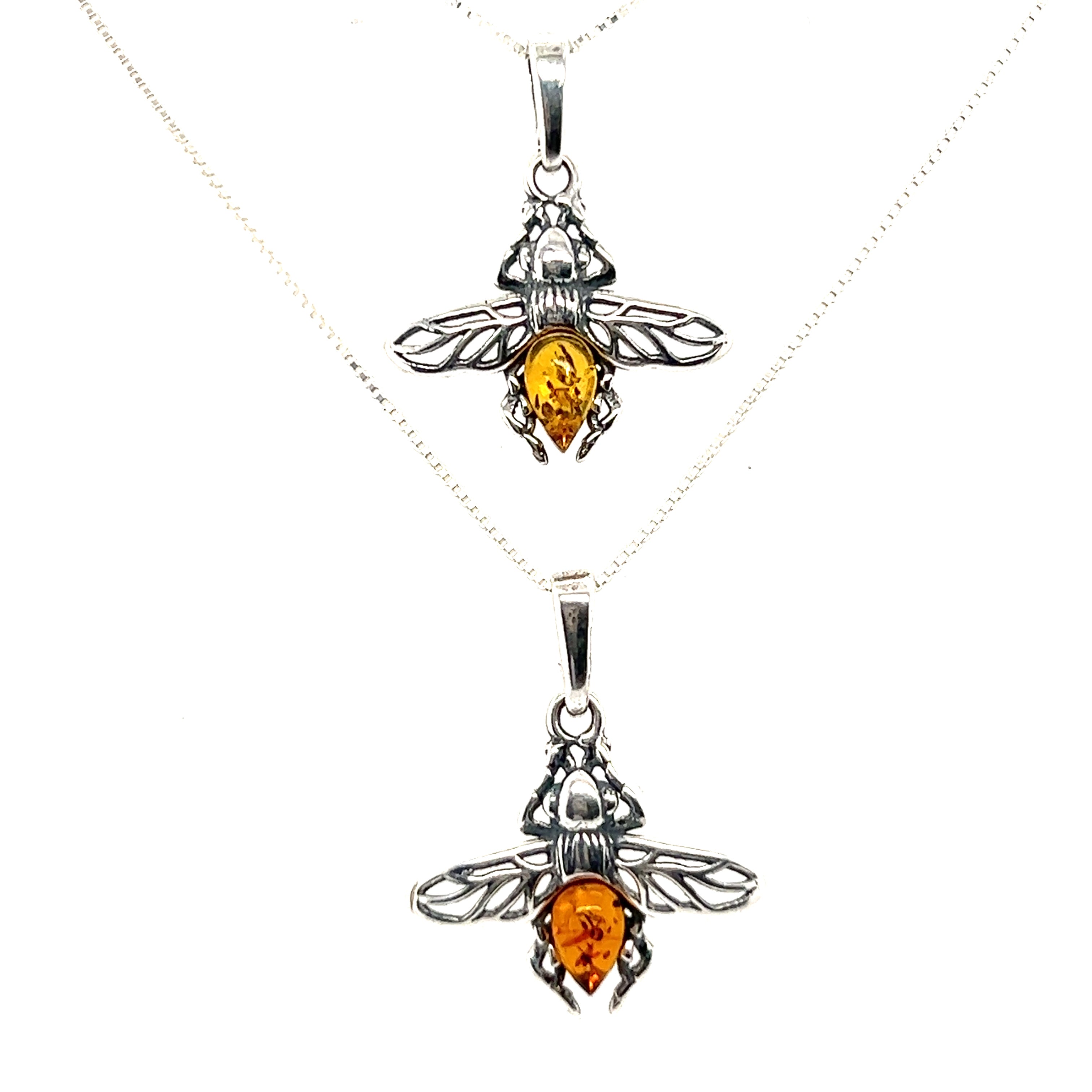 Two Super Silver delicate amber bee pendants with baltic amber crystals.