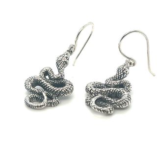 A mesmerizing pair of Super Silver's Alluring Snake Earrings on a white background.