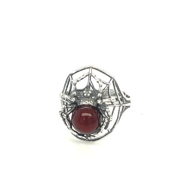 Entrancing Adjustable Baltic Amber Spider Ring featuring a prominent Baltic amber stone in the center, set against a plain white background.