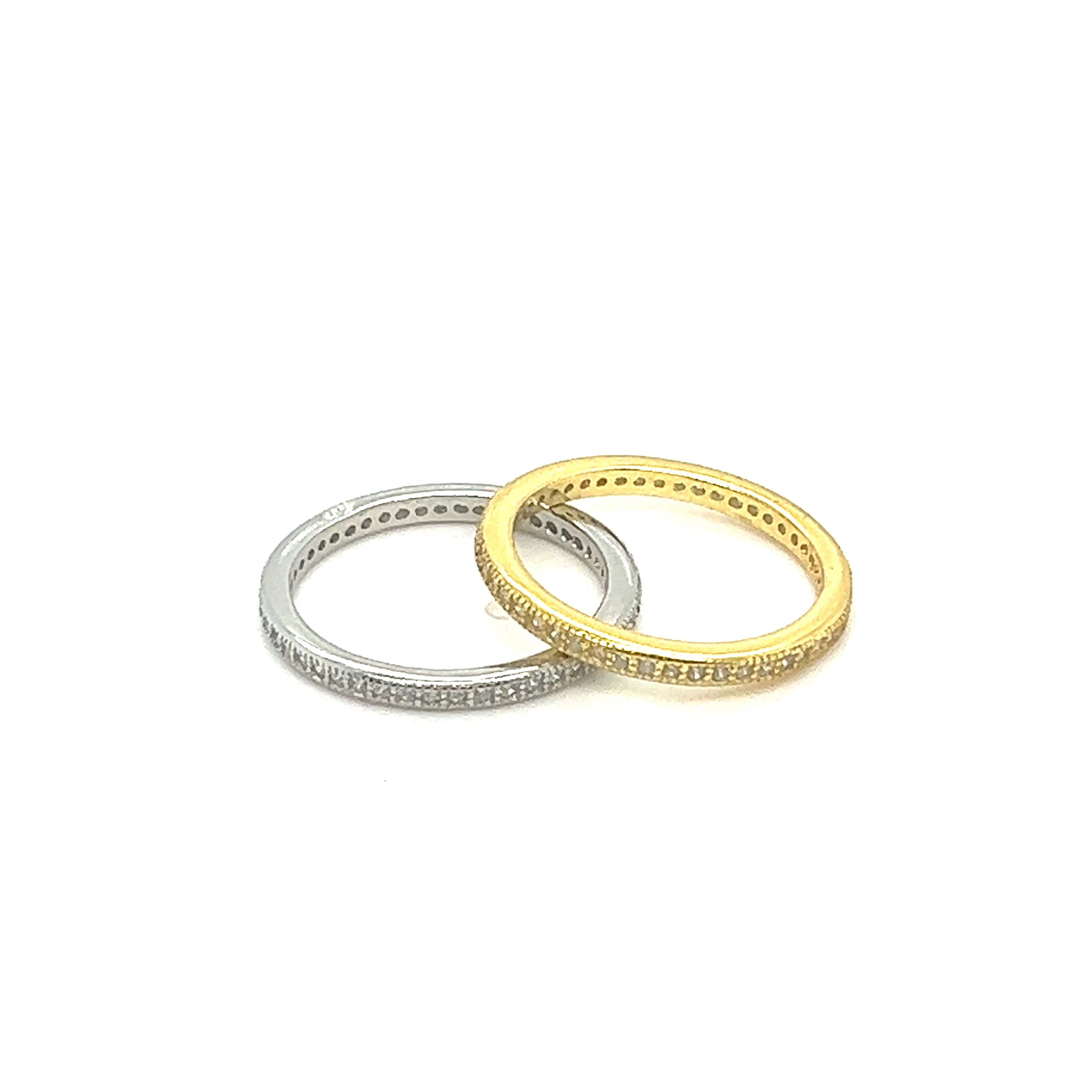 Two elegant gold and Classic Pave Cubic Zirconia Eternity stacking rings.