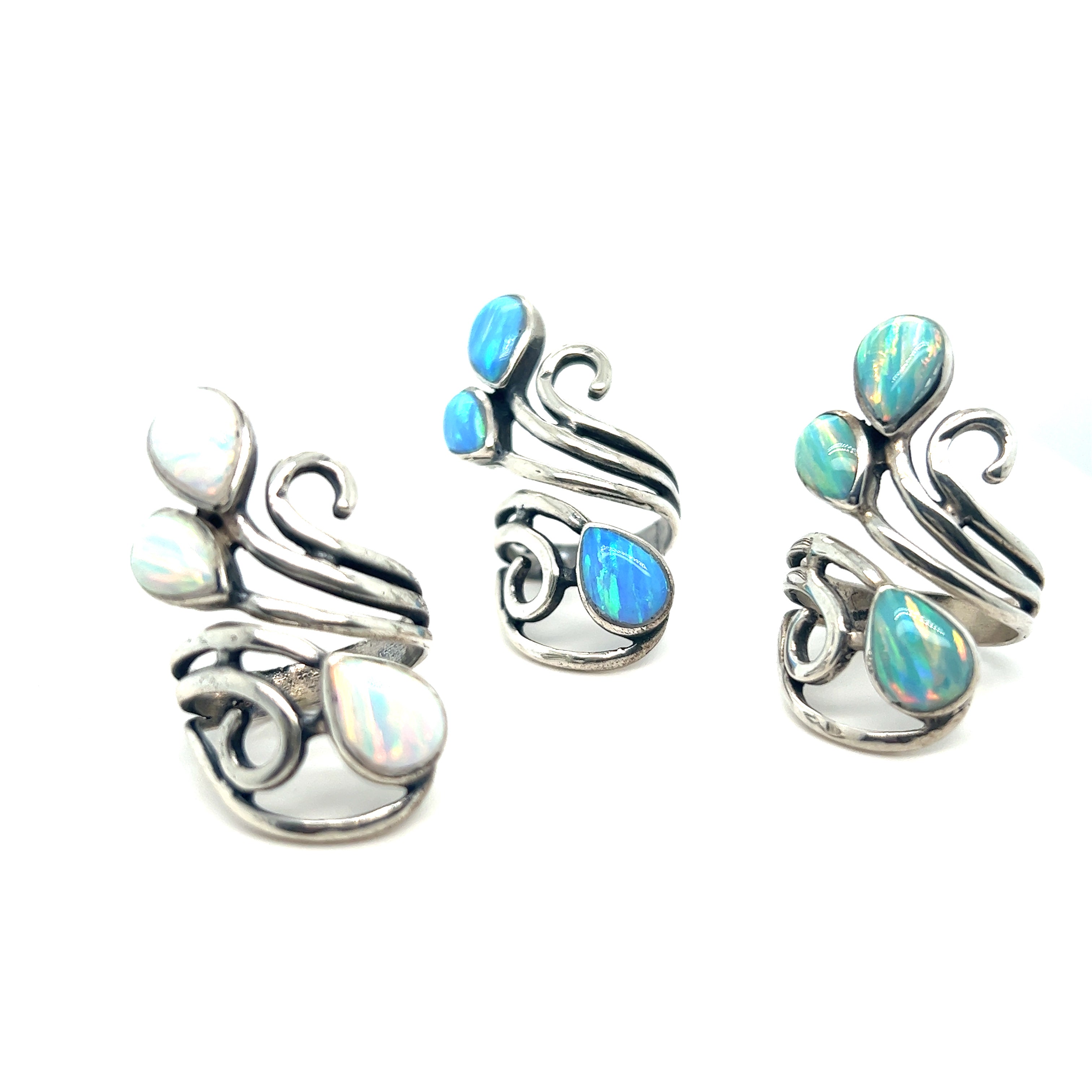 Super Silver presents the Stunning Wrap-Around Opal Ring, a handcrafted statement ring featuring opal stones in a stunning silver design.