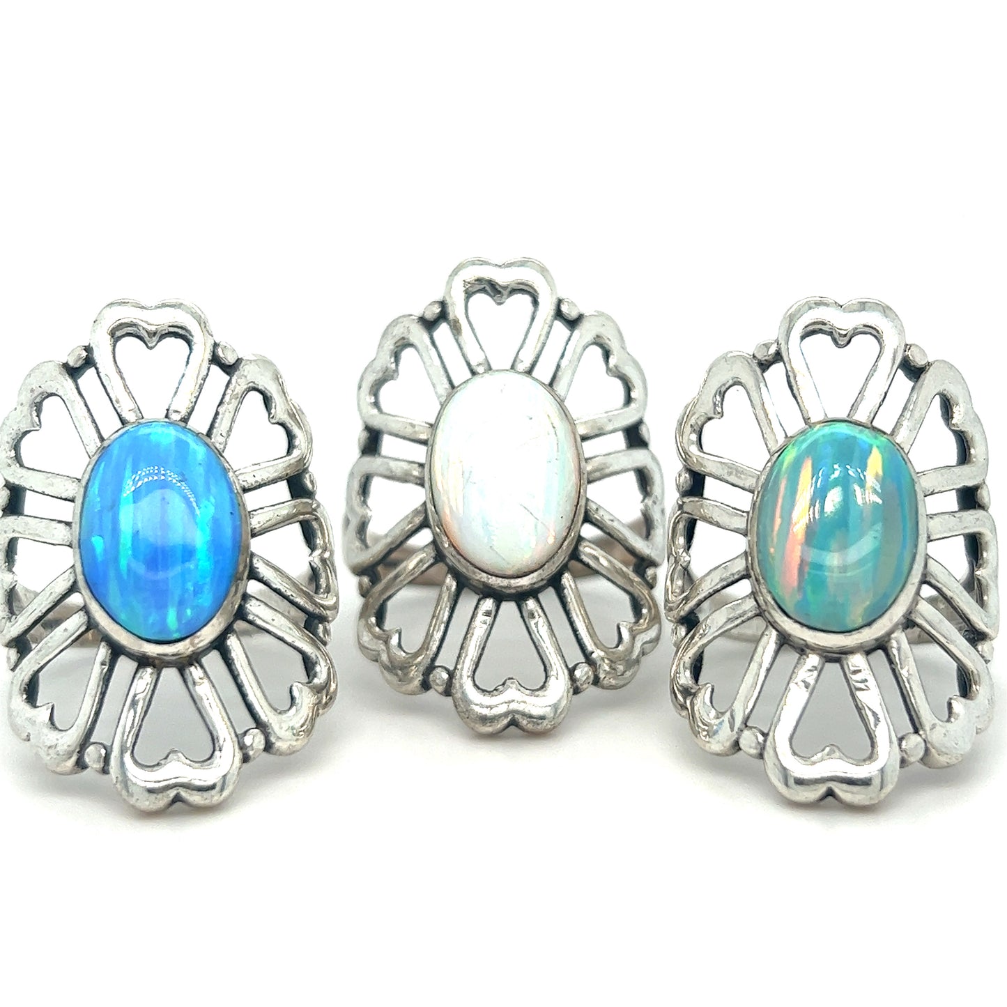 Super Silver's American Made Opal Flower Ring with Heart Shaped Petals features handcrafted silver rings embedded with opal stones.