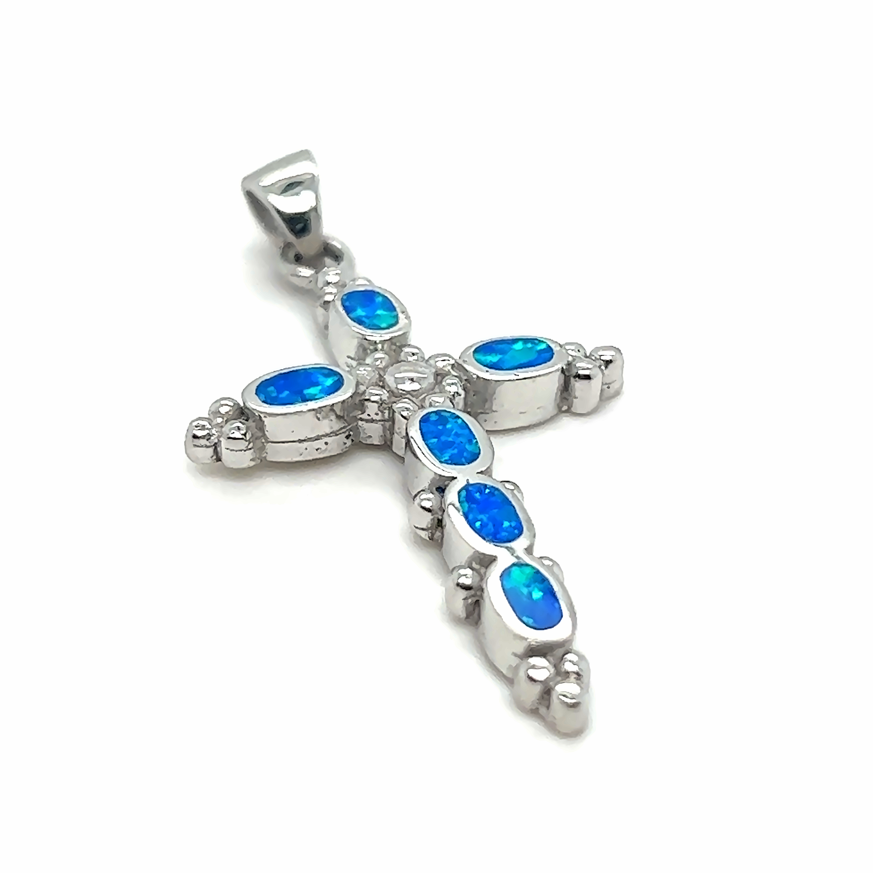 A Super Silver Blue Opal Cross Pendant With Oval Stones adorned with captivating blue opal stones.