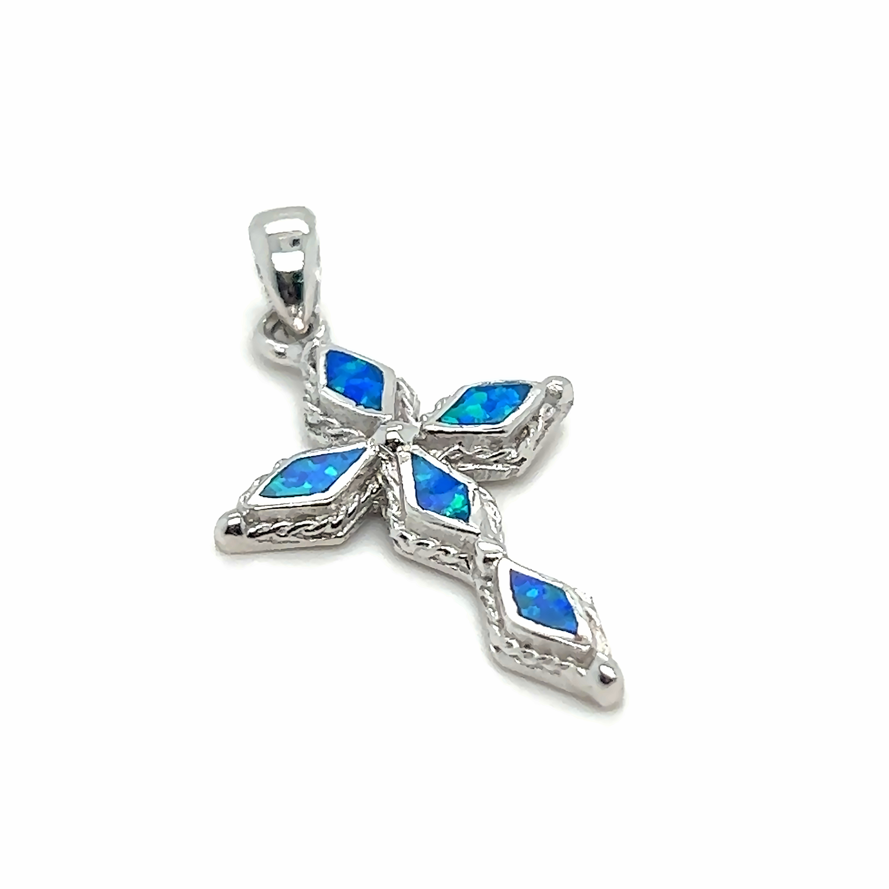 This Super Silver blue opal cross pendant features a rhodium finish for added shine and glamour to the sterling silver design. The diamond-cut stones add an extra touch of brilliance, making it a stunning piece.