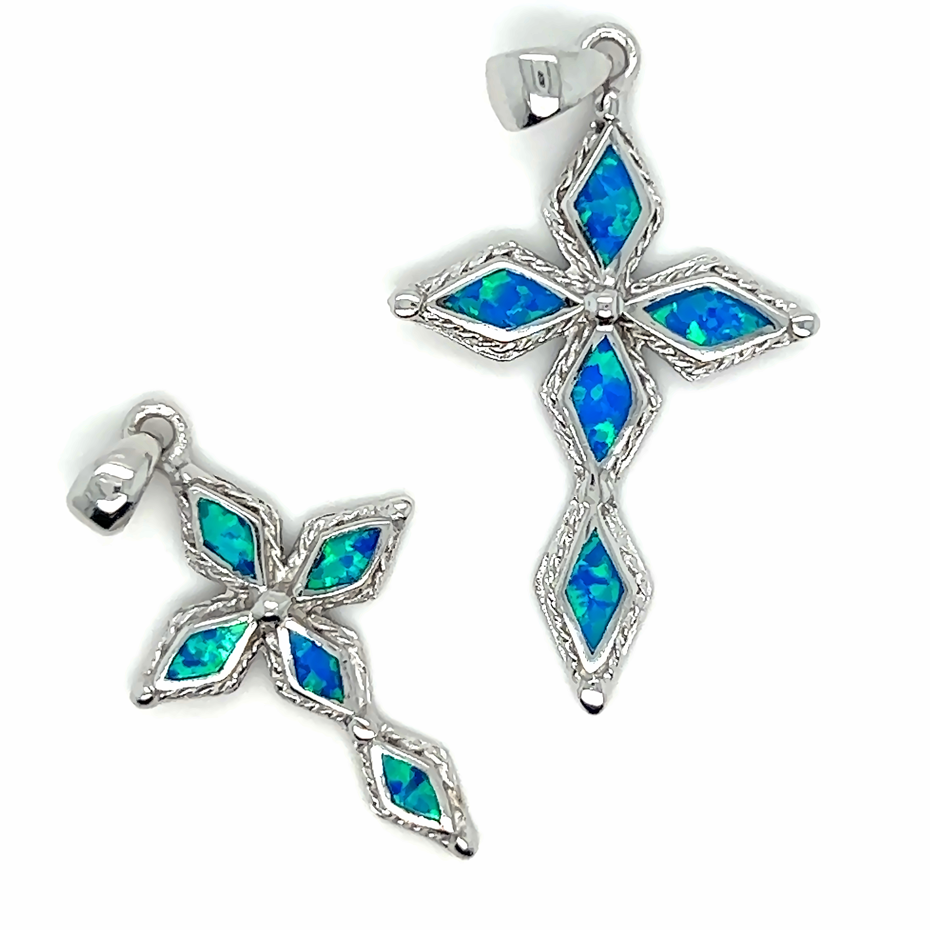 Two Super Silver Blue Opal Cross Pendants with a rhodium finish on a white background.