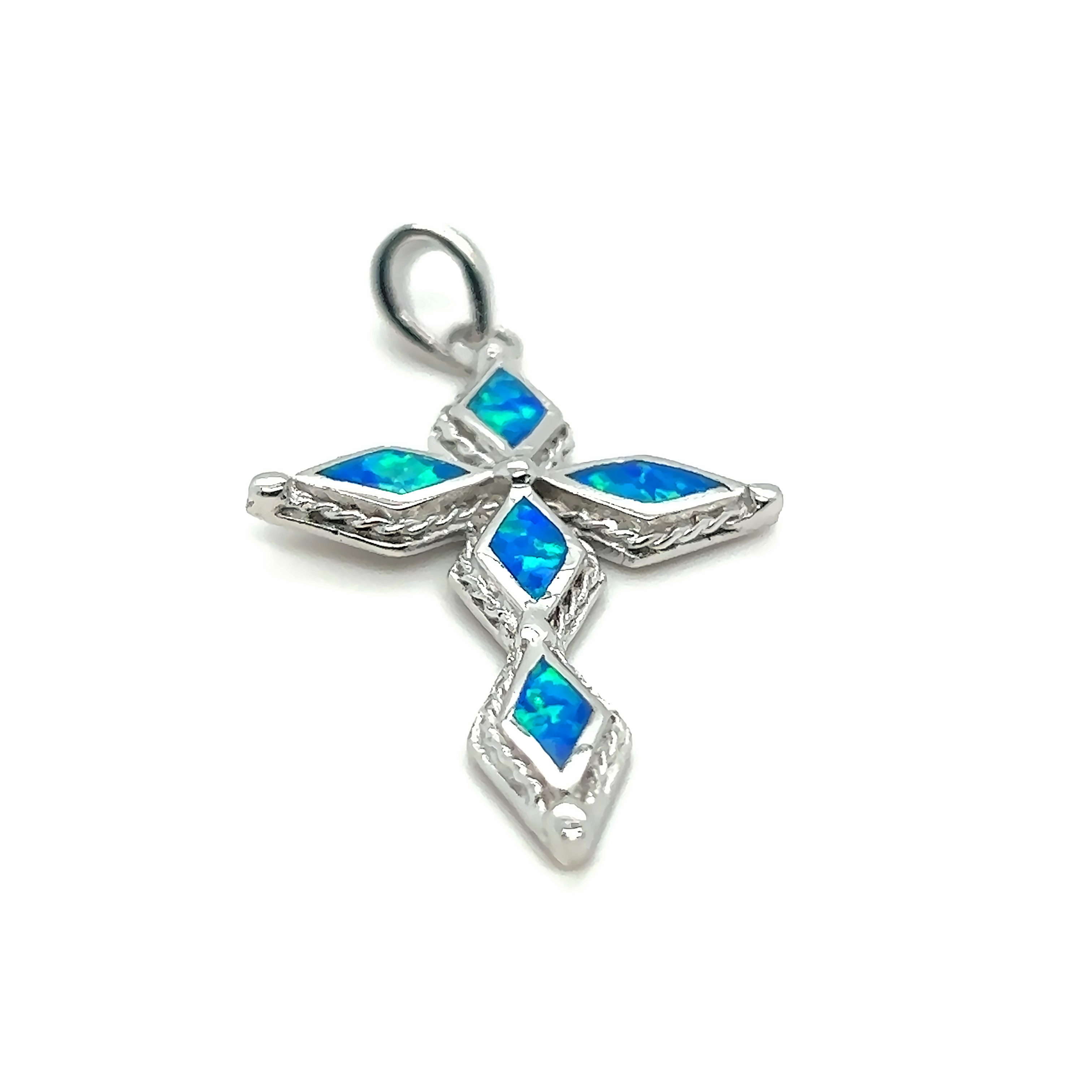 A Super Silver Blue Opal Cross Pendant adorned with diamond-cut stones.