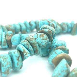 Dreamy Colorado Turquoise Beaded Necklace by Super Silver brings earthy class to everyday life with its turquoise stone beads on a white background.