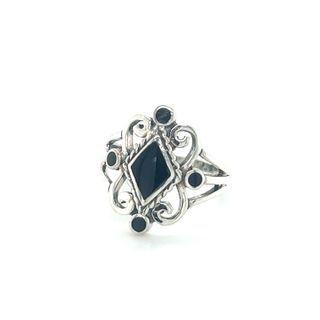 A Victorian style inlay ring crafted from sterling silver with a black stone.