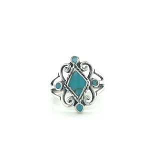 A Victorian Style Inlay Ring with blue stone inlay.