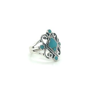 A Victorian style inlay ring featuring a blue stone, crafted from Sterling Silver.
