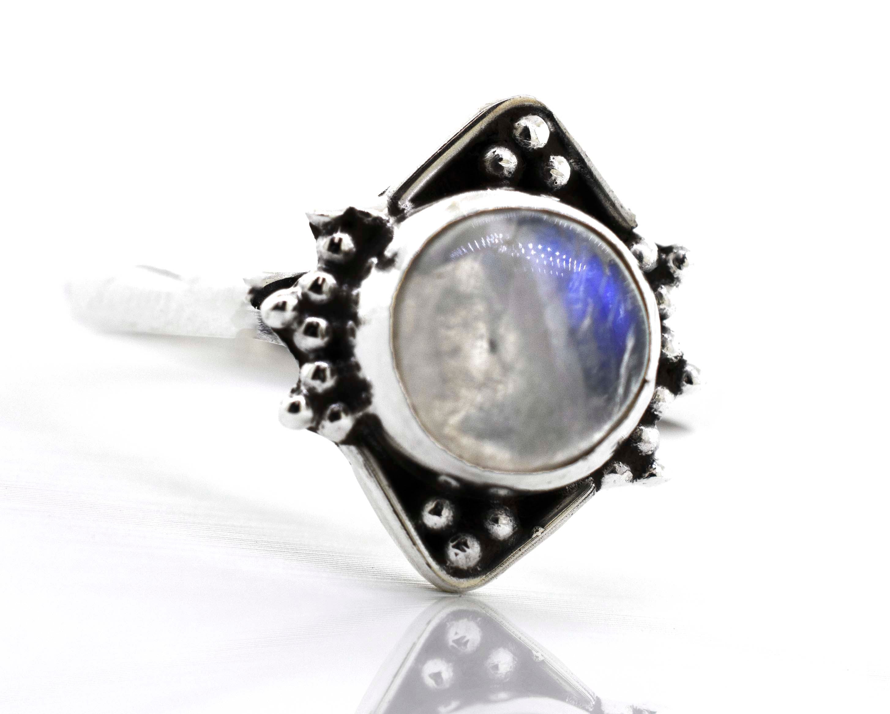 A Super Silver Round Gemstone Ring With Oxidized Diamond Shape Pattern in the center.