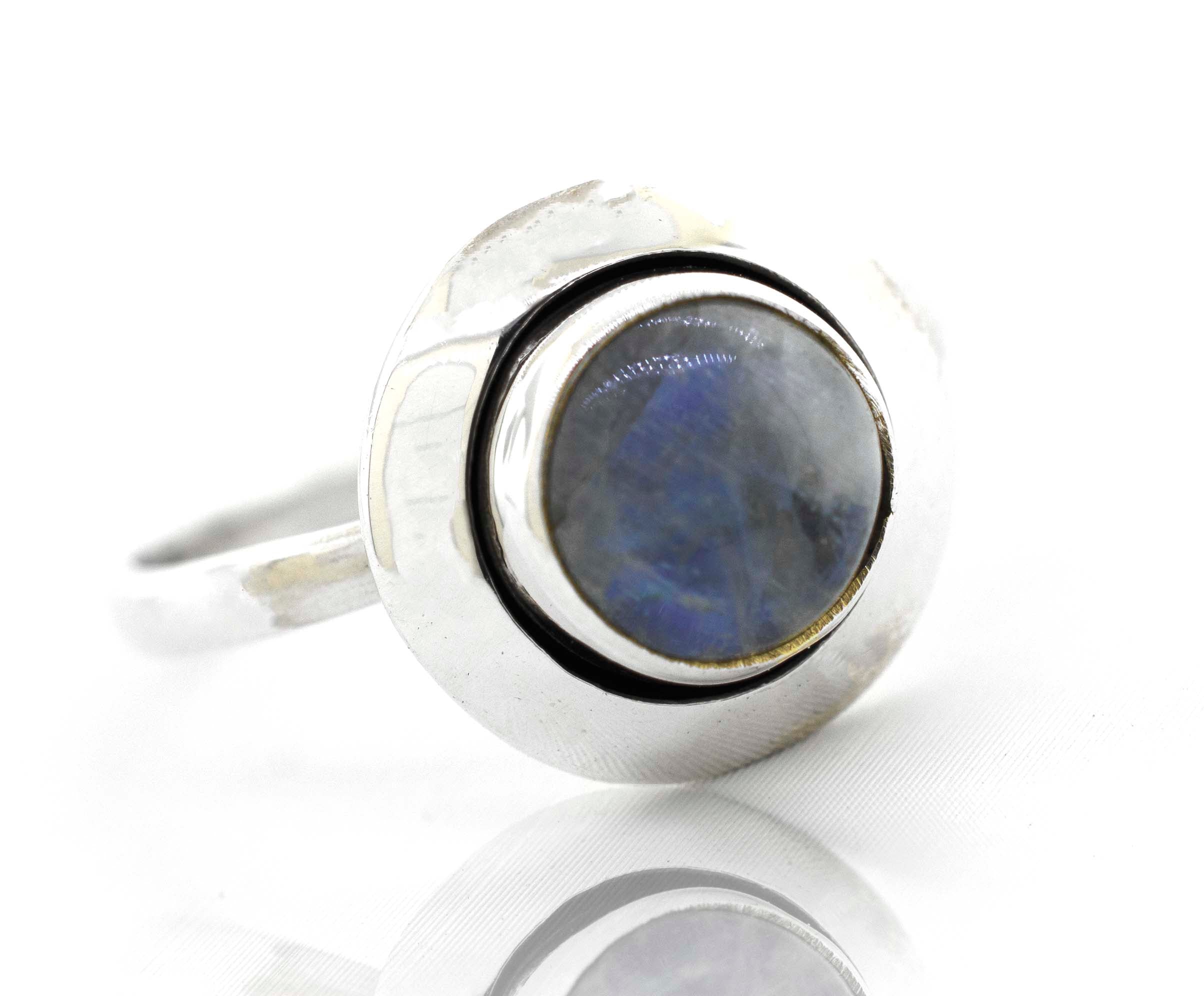 This contemporary Round Gemstone Ring With Oxidized Outline from Super Silver showcases a minimalist design with a stunning blue labradorite stone.