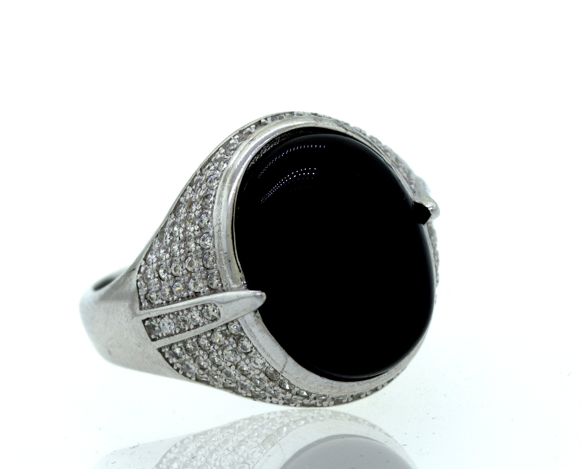 An elegant Onyx And Cubic Zirconia ring on a white background.