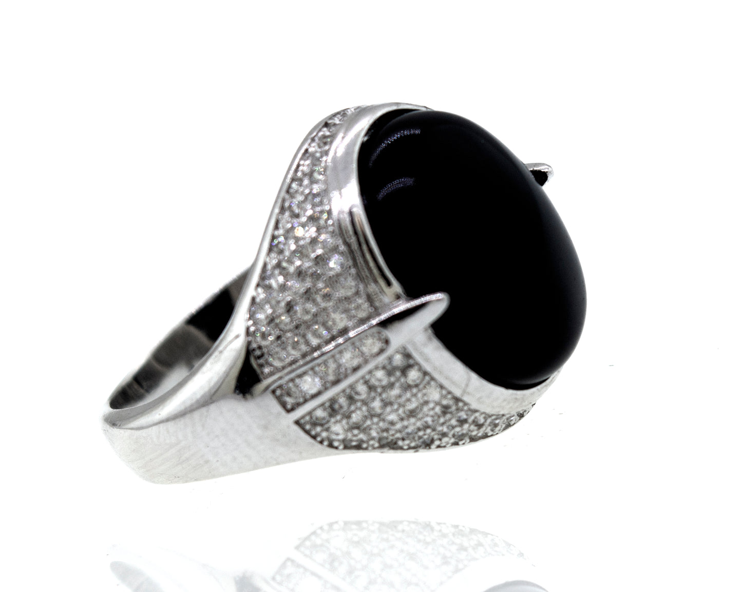 An elegant Super Silver ring featuring an oval Onyx And Cubic Zirconia stone, accentuated by shimmering diamonds, set on a pristine white background.