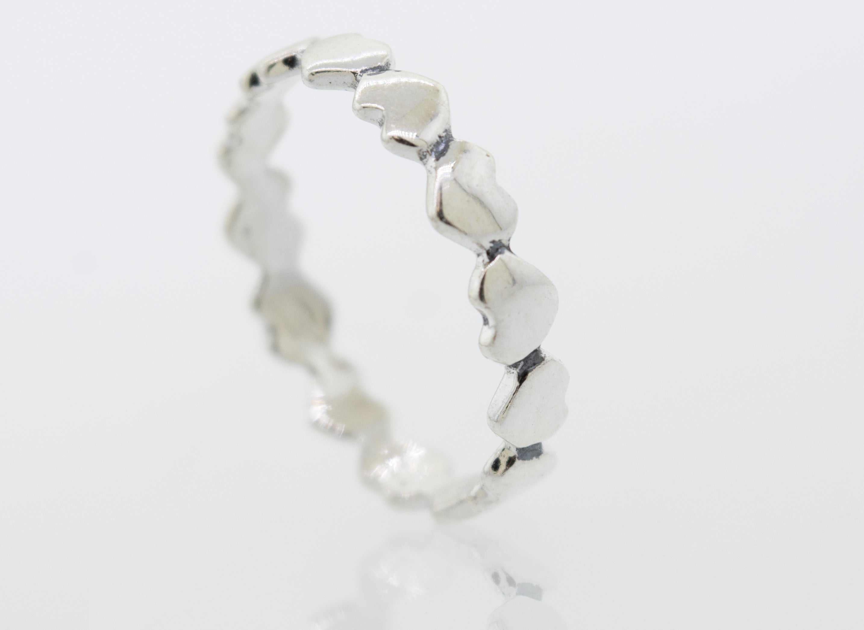 A sterling silver Hearts Band With Alternating Pattern.