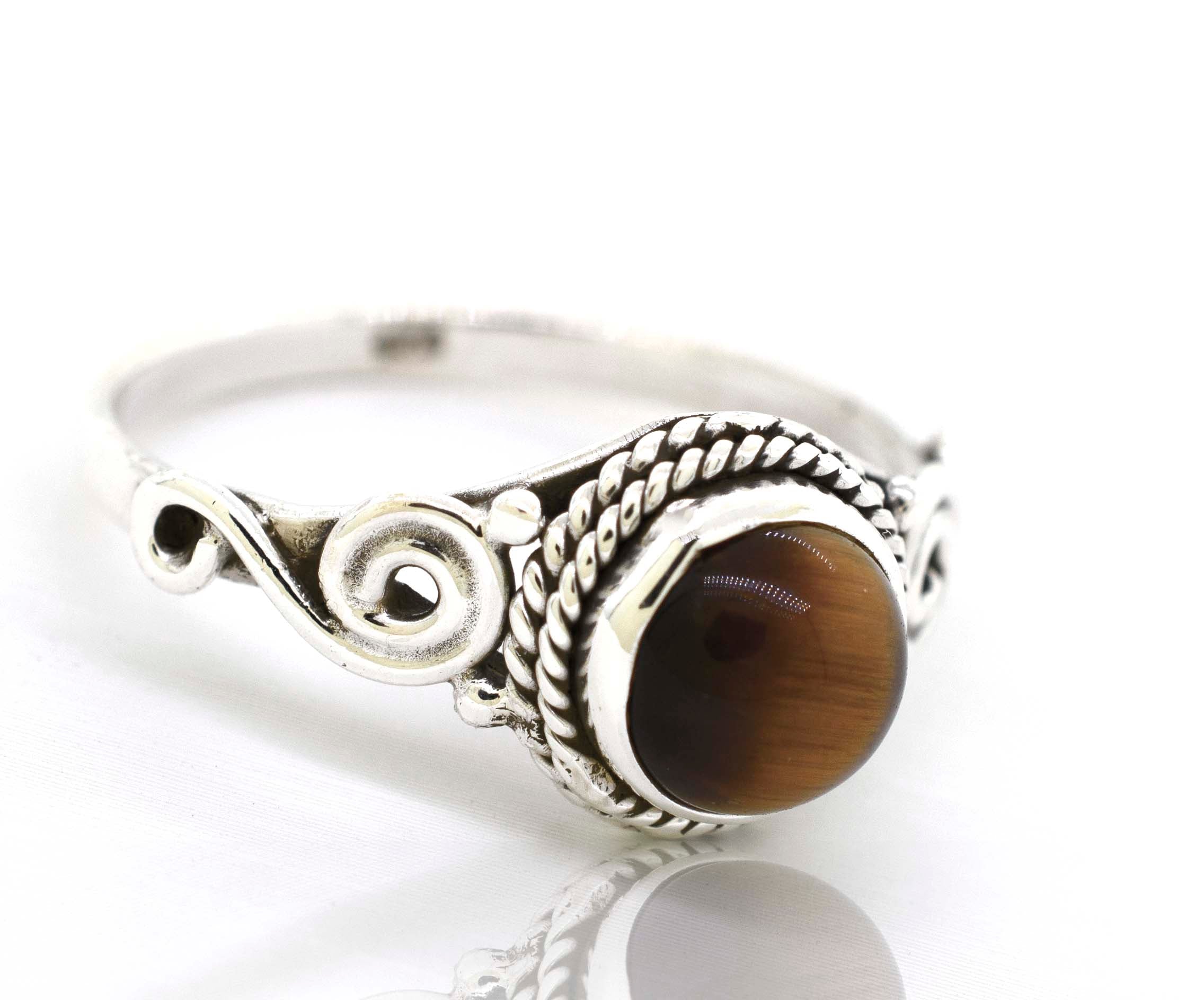 A bohemian vibe meets modern elegance with this Super Silver .925 sterling silver gemstone circle ring featuring a stunning tiger eye stone.