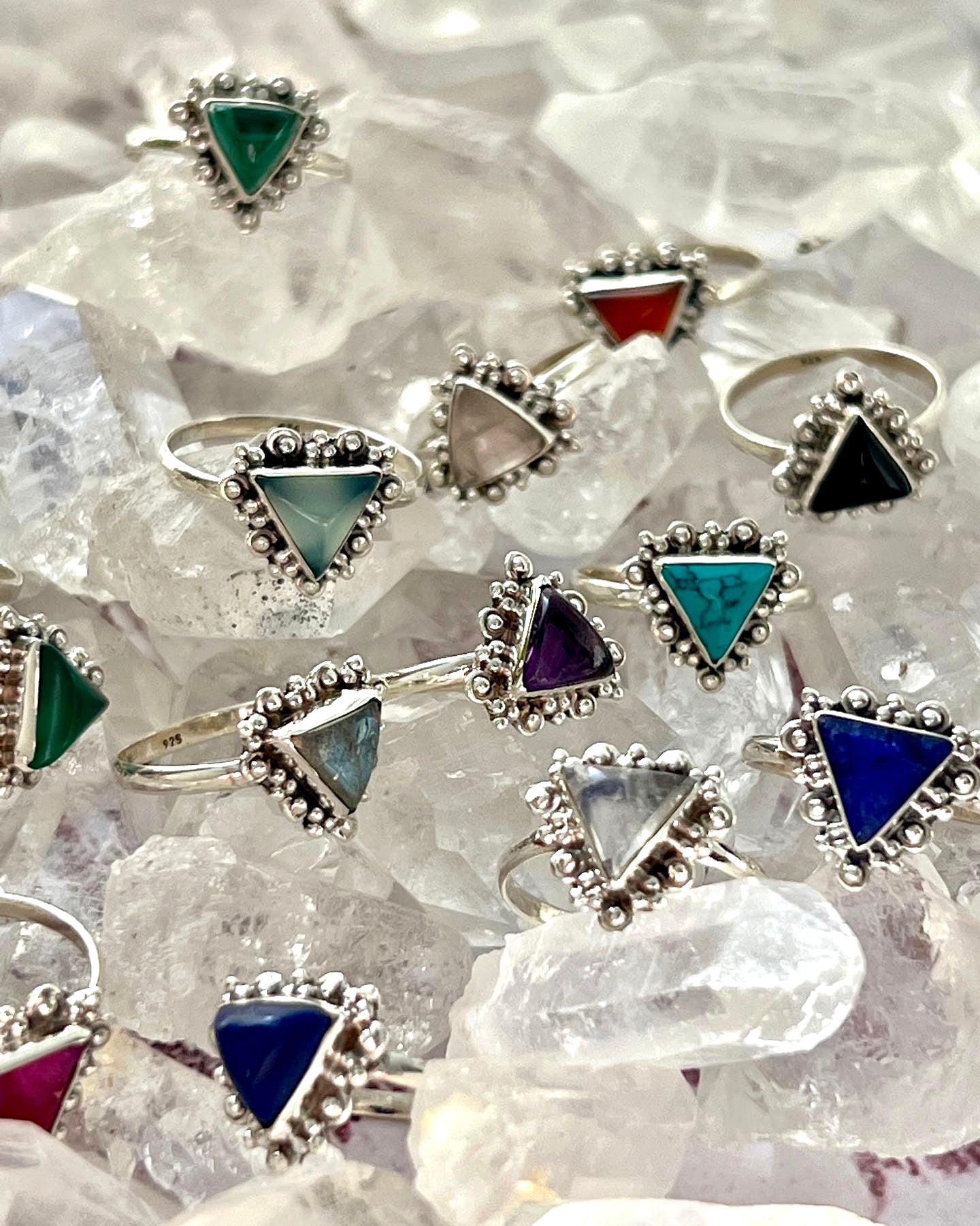 A group of Delicate Gemstone Triangle Rings with different colored stones on them, perfect for the Santa Cruz vibe.